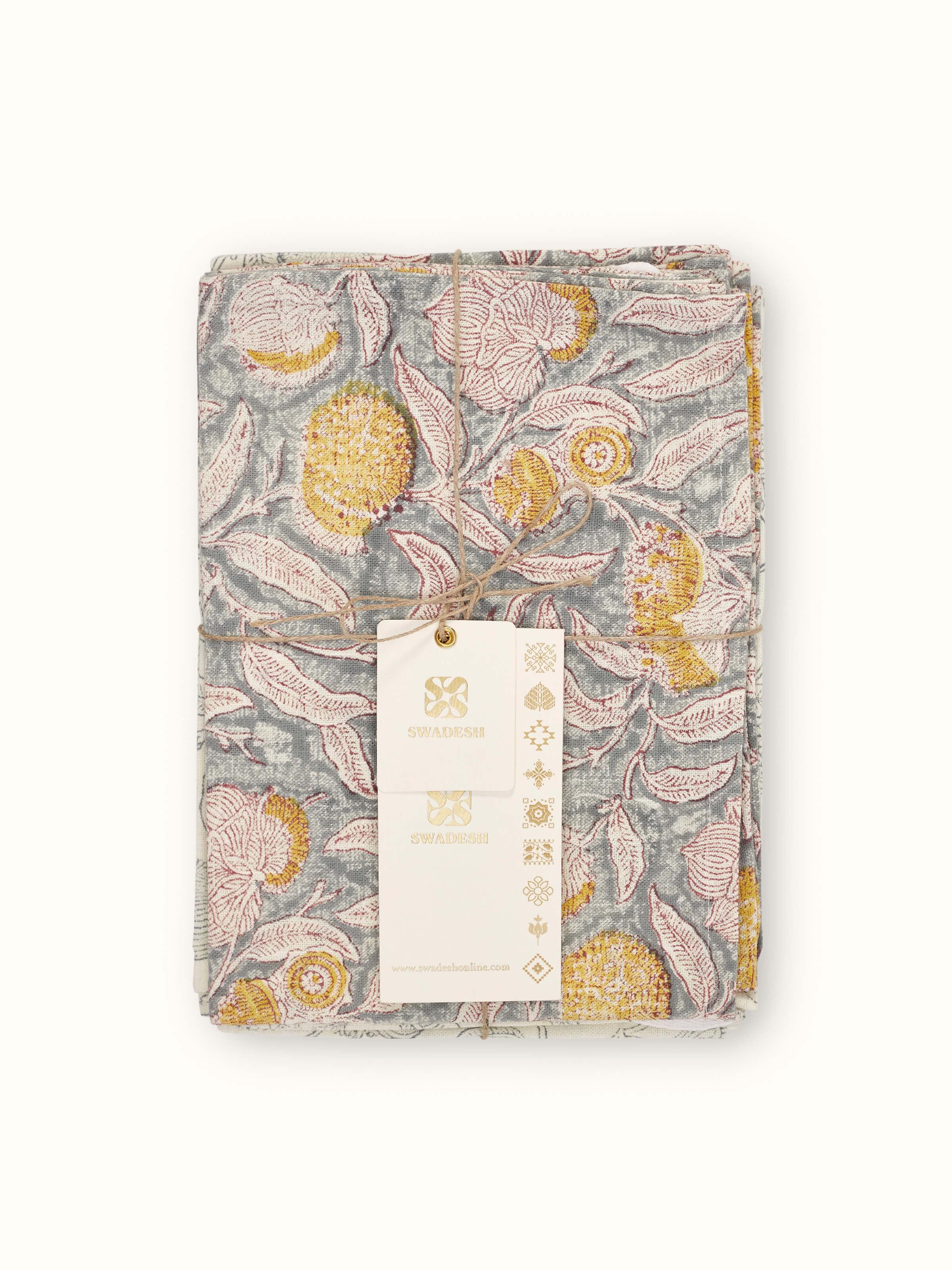 Samaha grey floral dish towels arranged to show the repeating block print pattern and soft cotton texture.