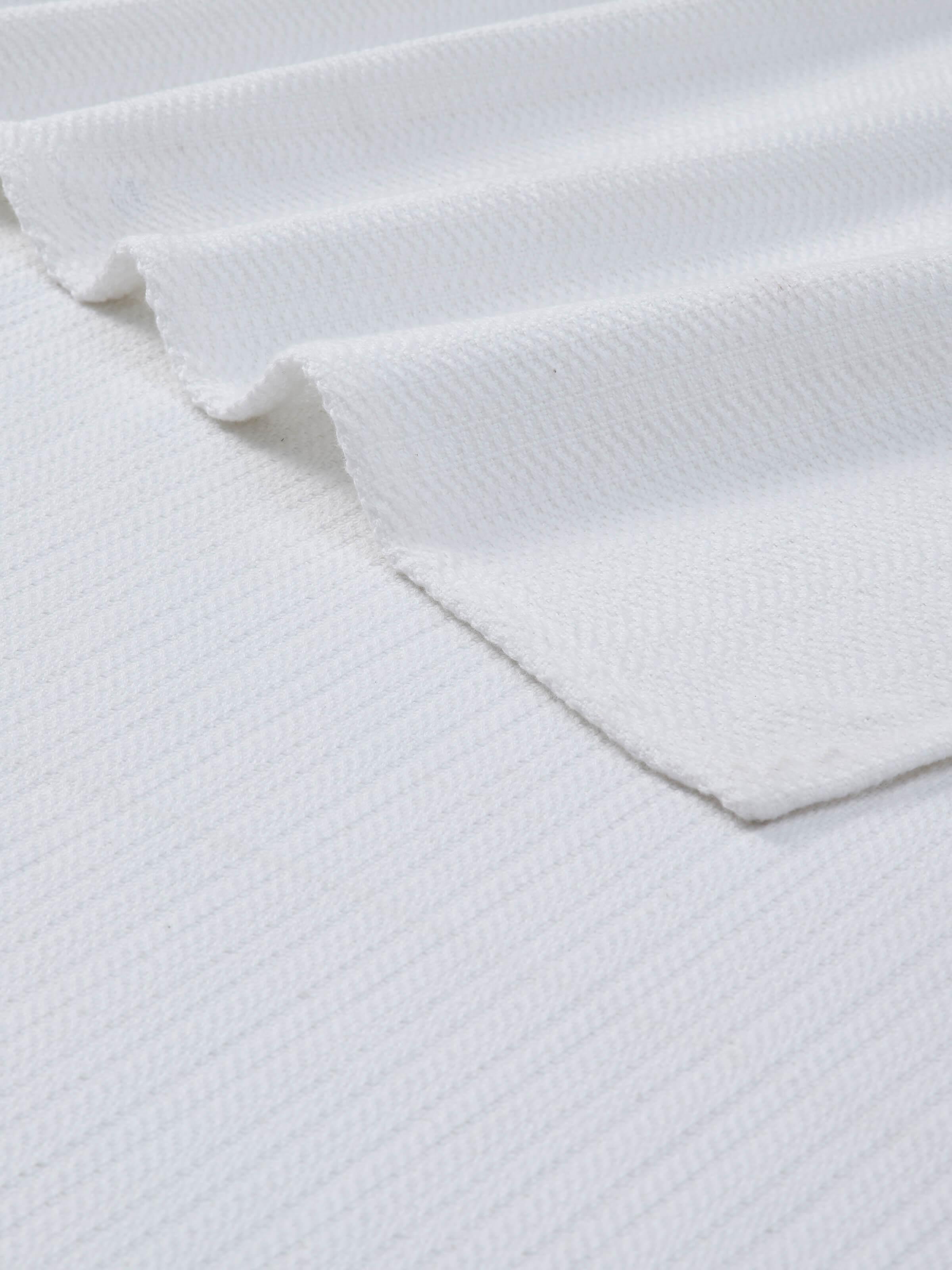 Detailed view of Vayana stripe white cotton bath towel (XL) showing the cotton fabric's quality and stripe design.
