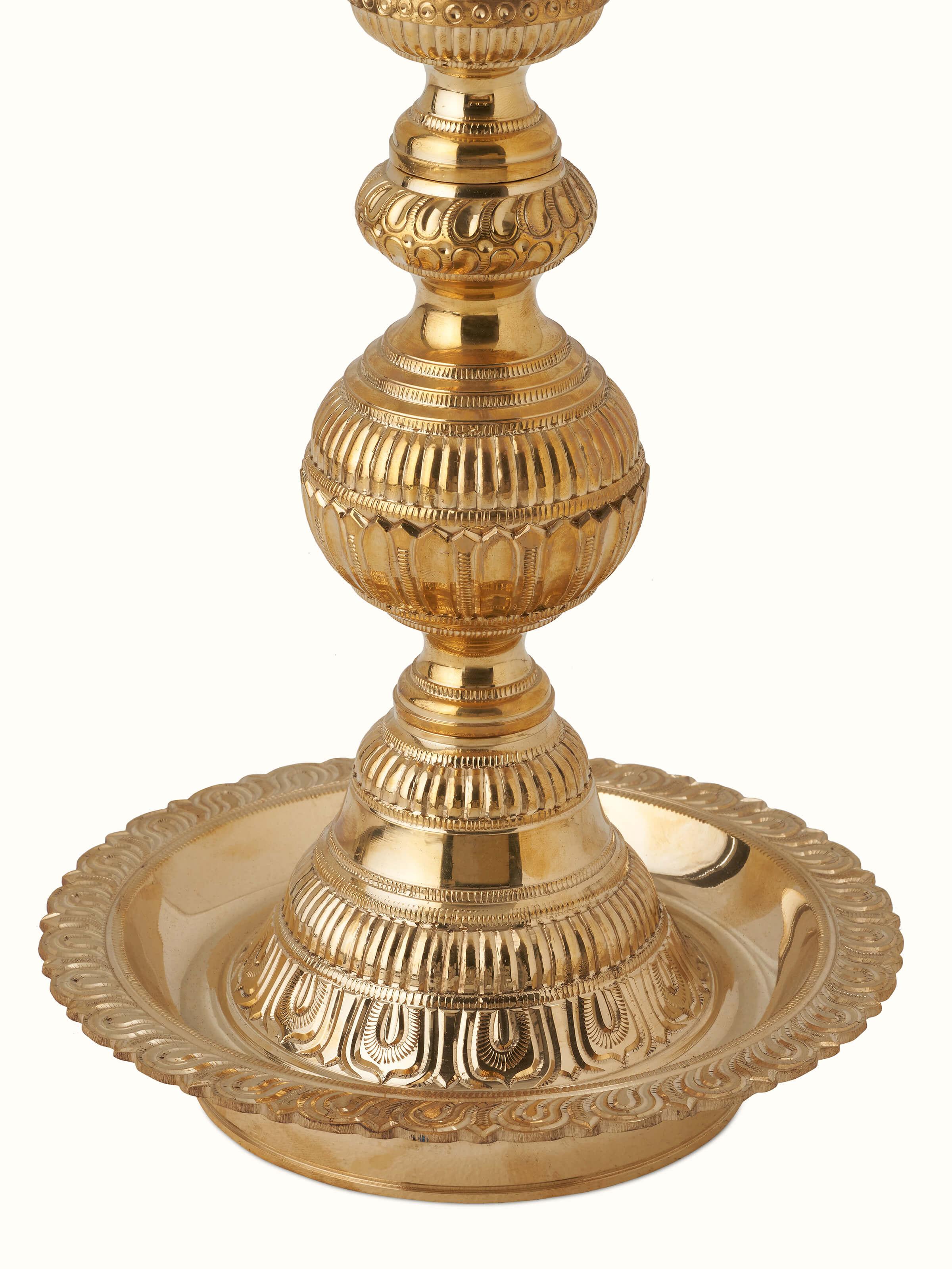 Close-up view of Polished brass vilakku stand diya, showcasing the fine brasswork and intricate patterns