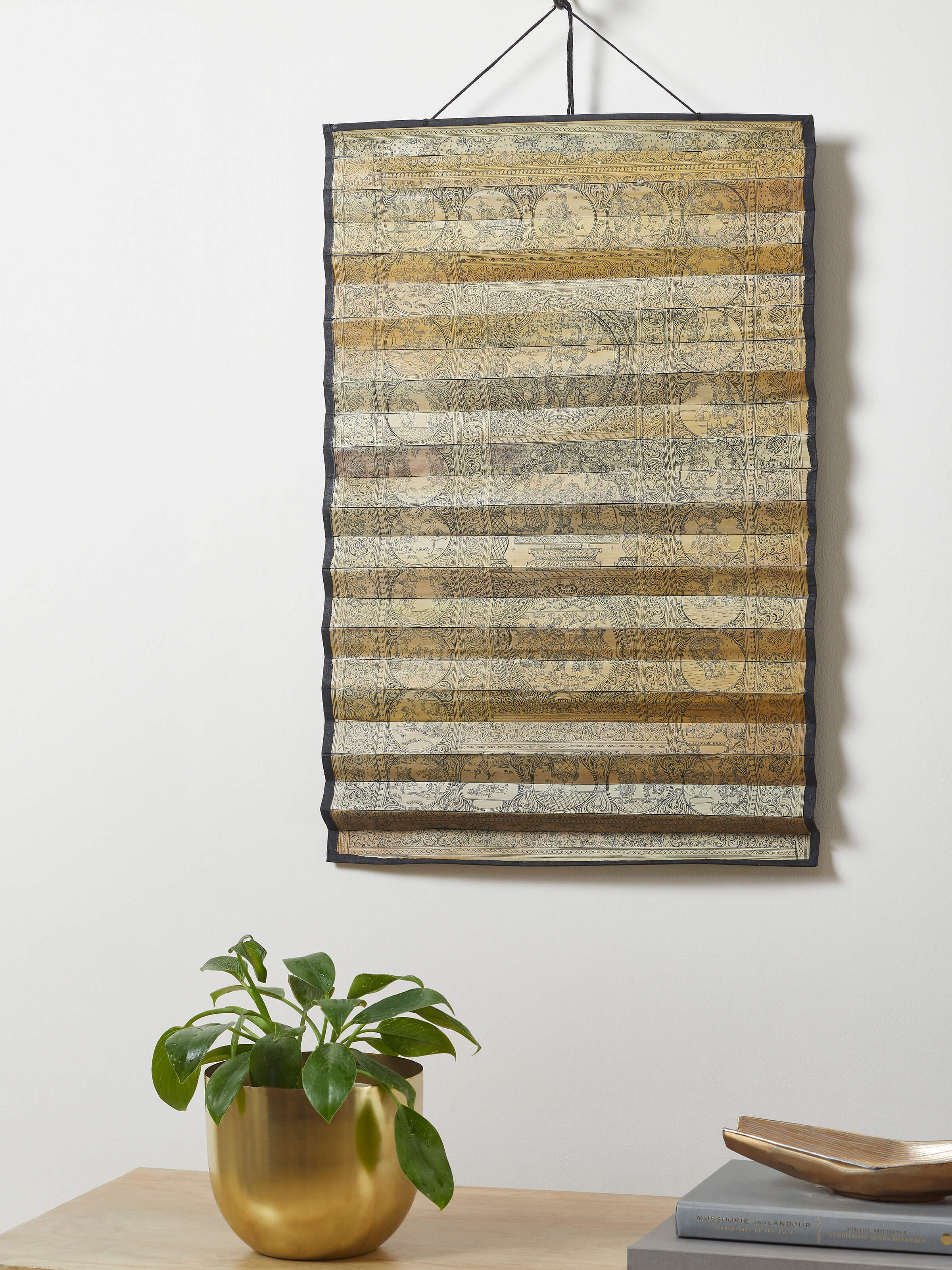 Side view of Palm leaf engraved lord Krishna narrative wall art with detailed carving