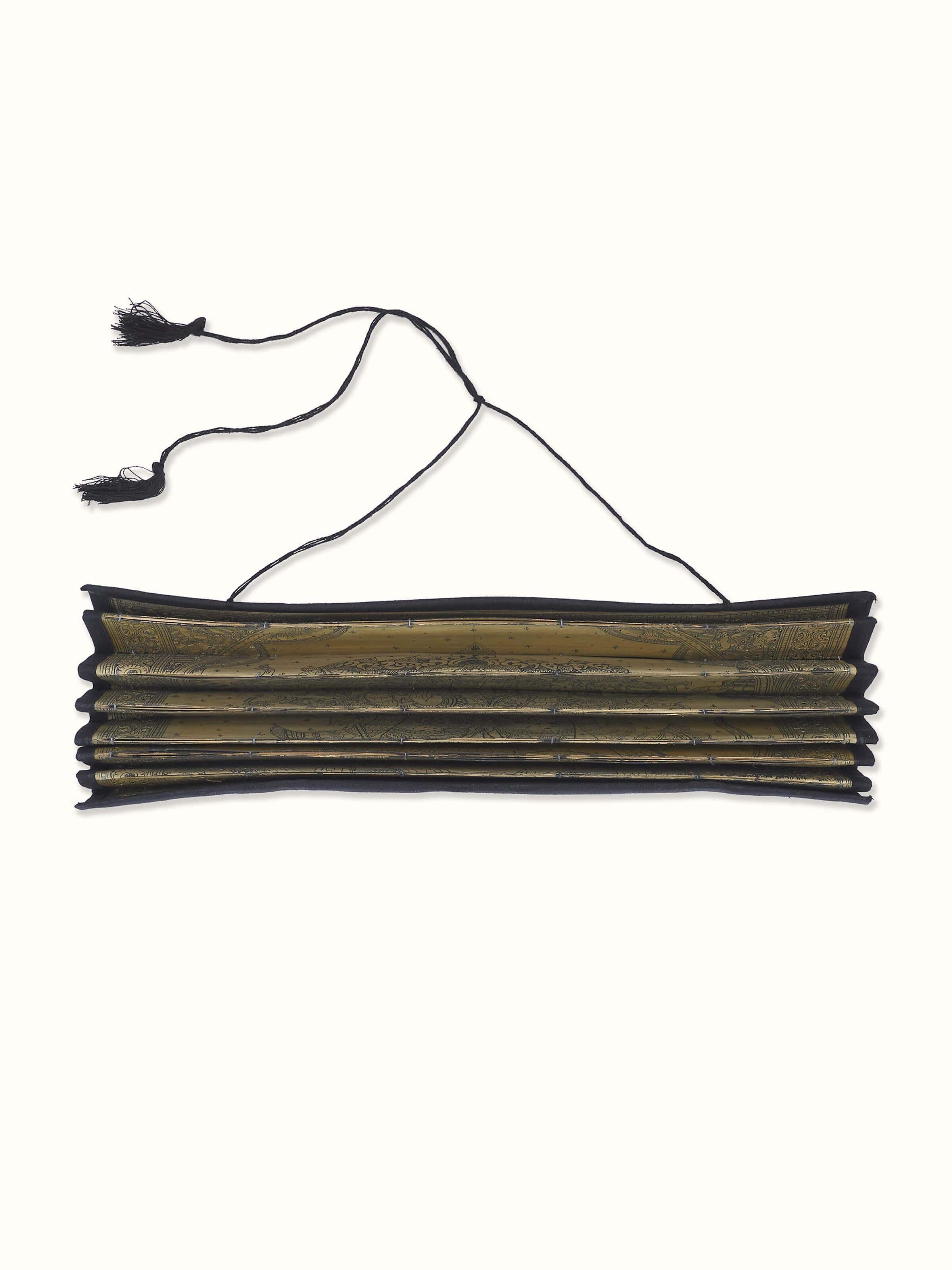 Detailed view of Palm Leaf Engraved Vakratunda Ganesha Wall Art, emphasizing the fine craftsmanship and divine imagery.