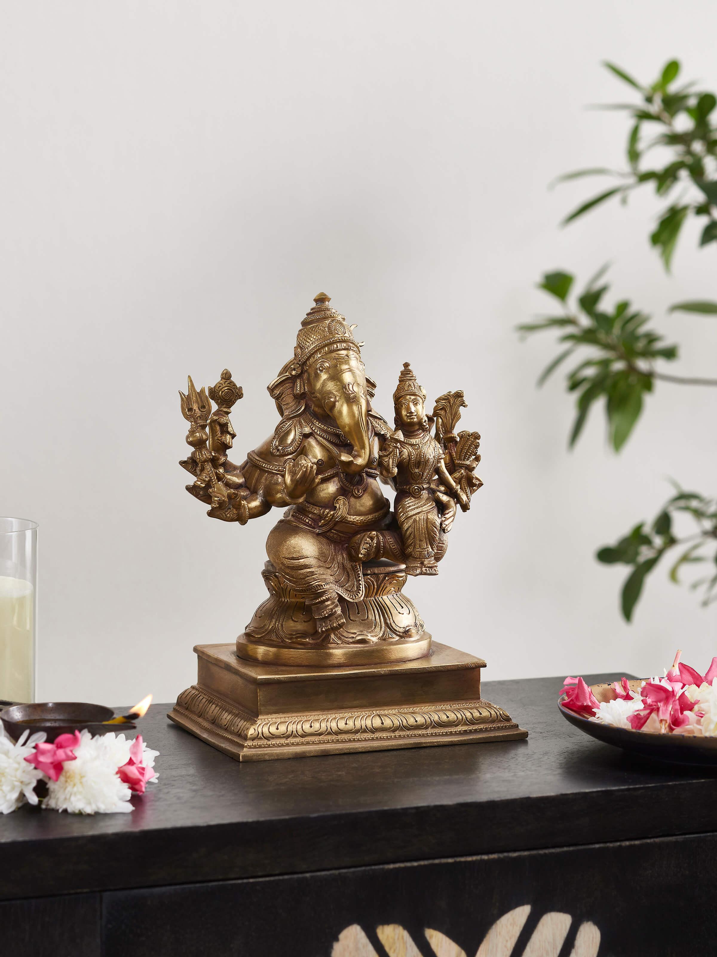 Side view of Lord Ganesha bronze casting idol highlighting the detailed bronze work and artistic pose.