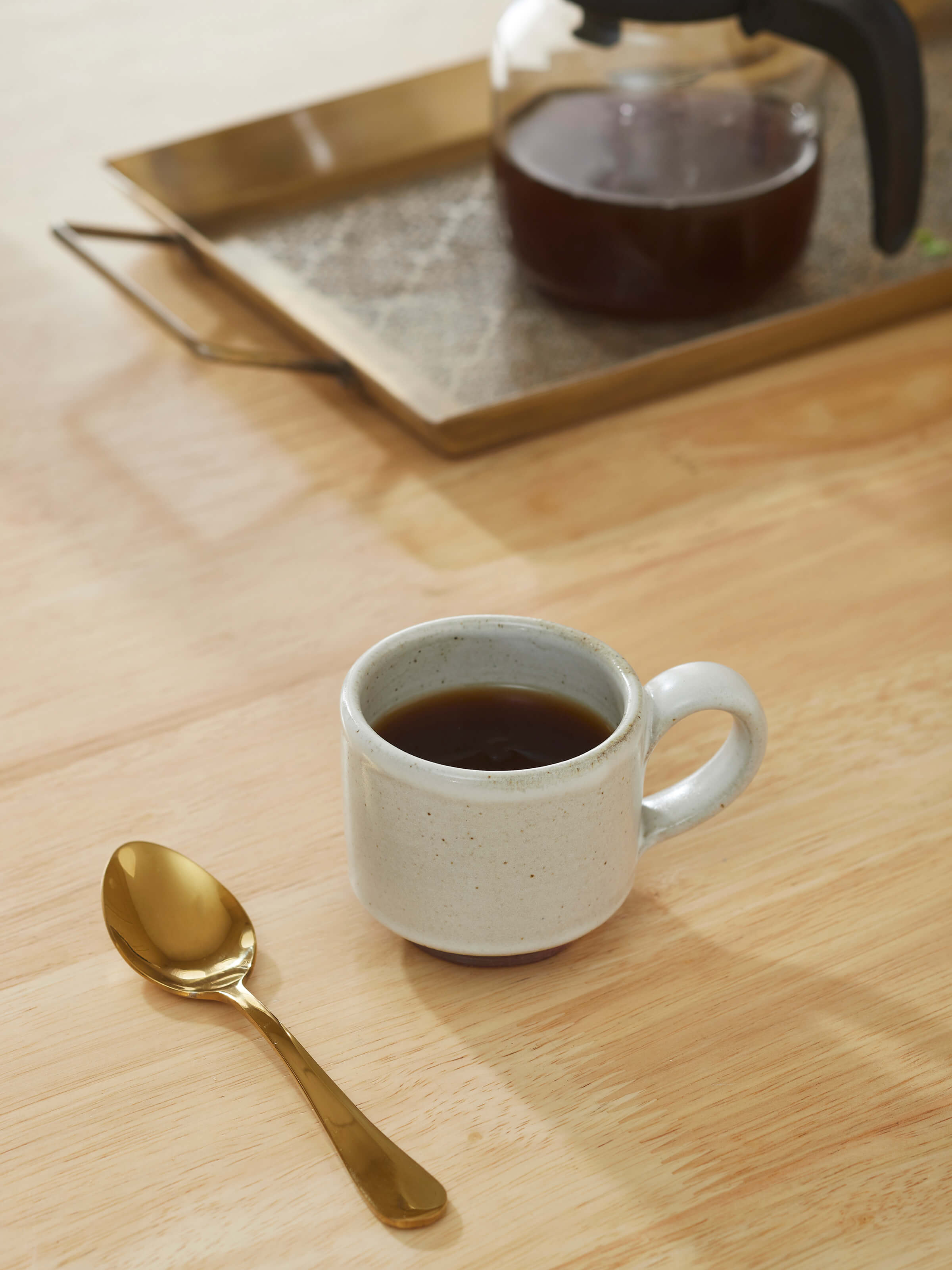 Side view of Studio Pottery Ceramic Demitasse Cup, highlighting its shape and delicate handle