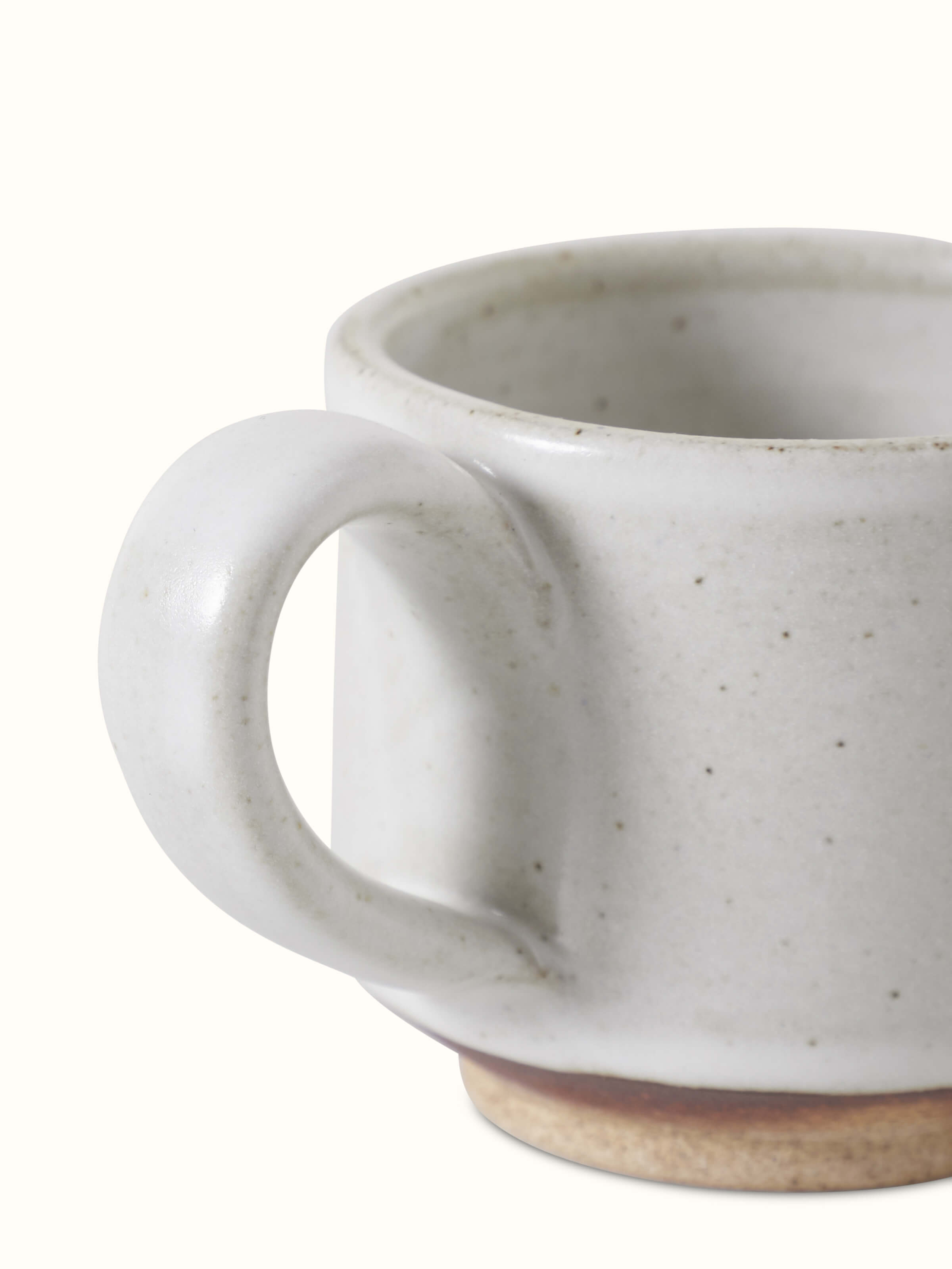 Angled view of Studio Pottery Ceramic Demitasse Cup, showing the subtle details and color variations