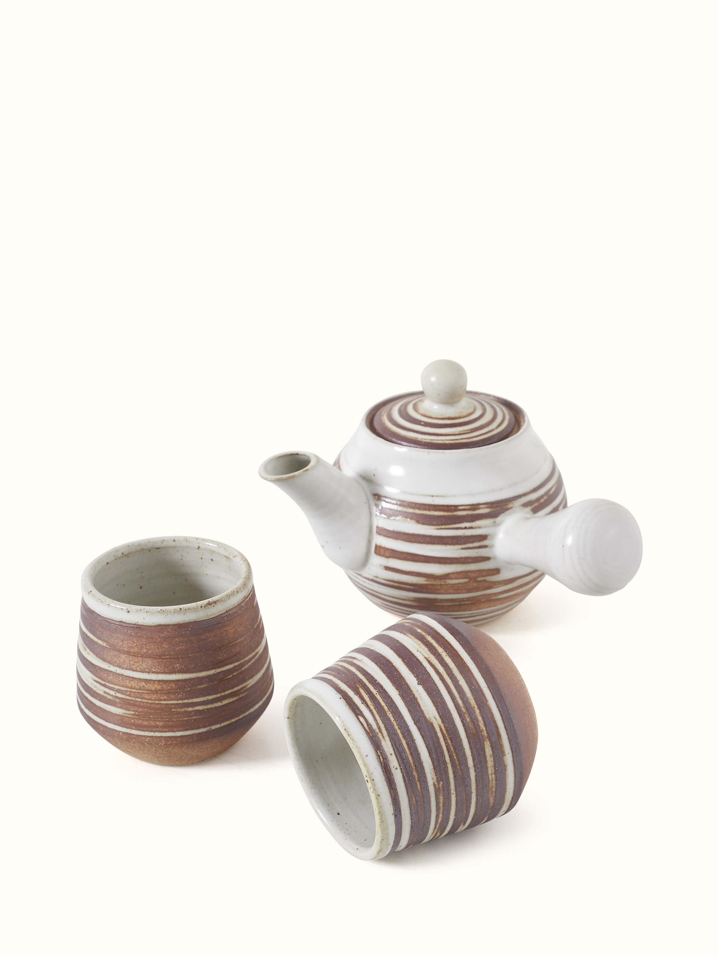 Angled view of Studio pottery ceramic tea set (2 pcs) highlighting the intricate glaze