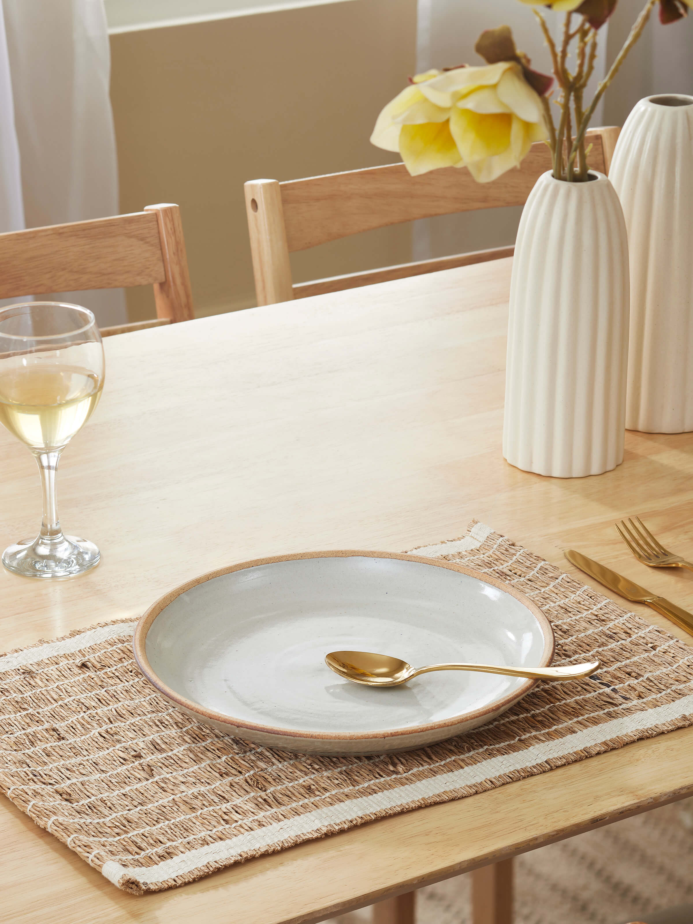 Close-up of studio pottery ceramic quarter plate, highlighting the unique glaze pattern and finish.
