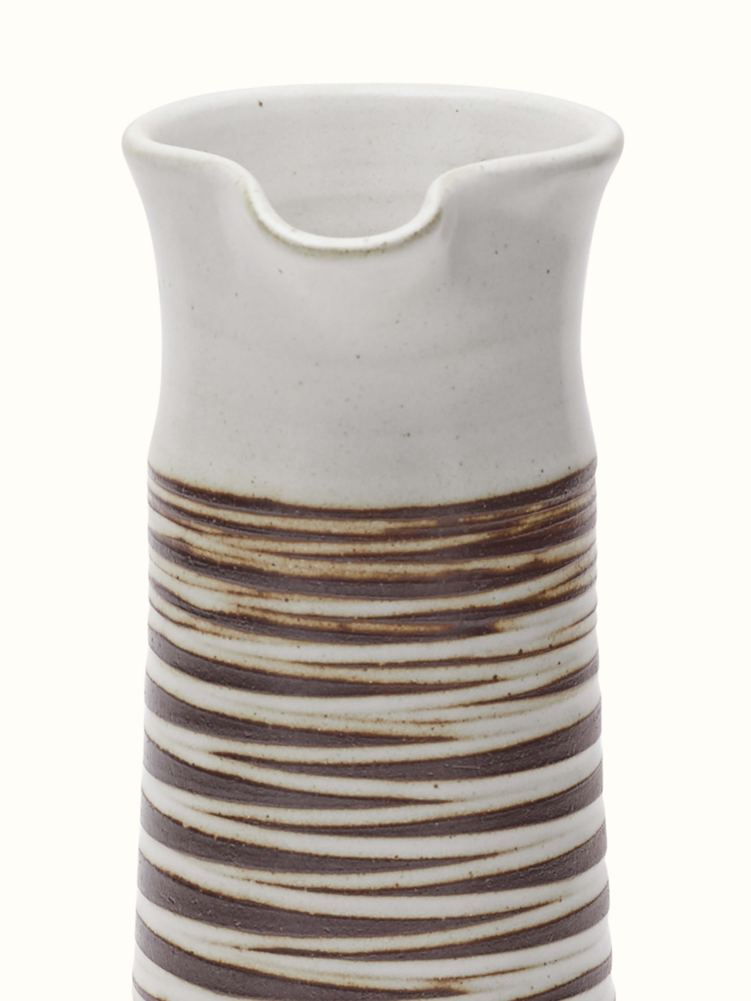 Side view of studio pottery ceramic carafe, highlighting its smooth curves and unique ceramic finish.
