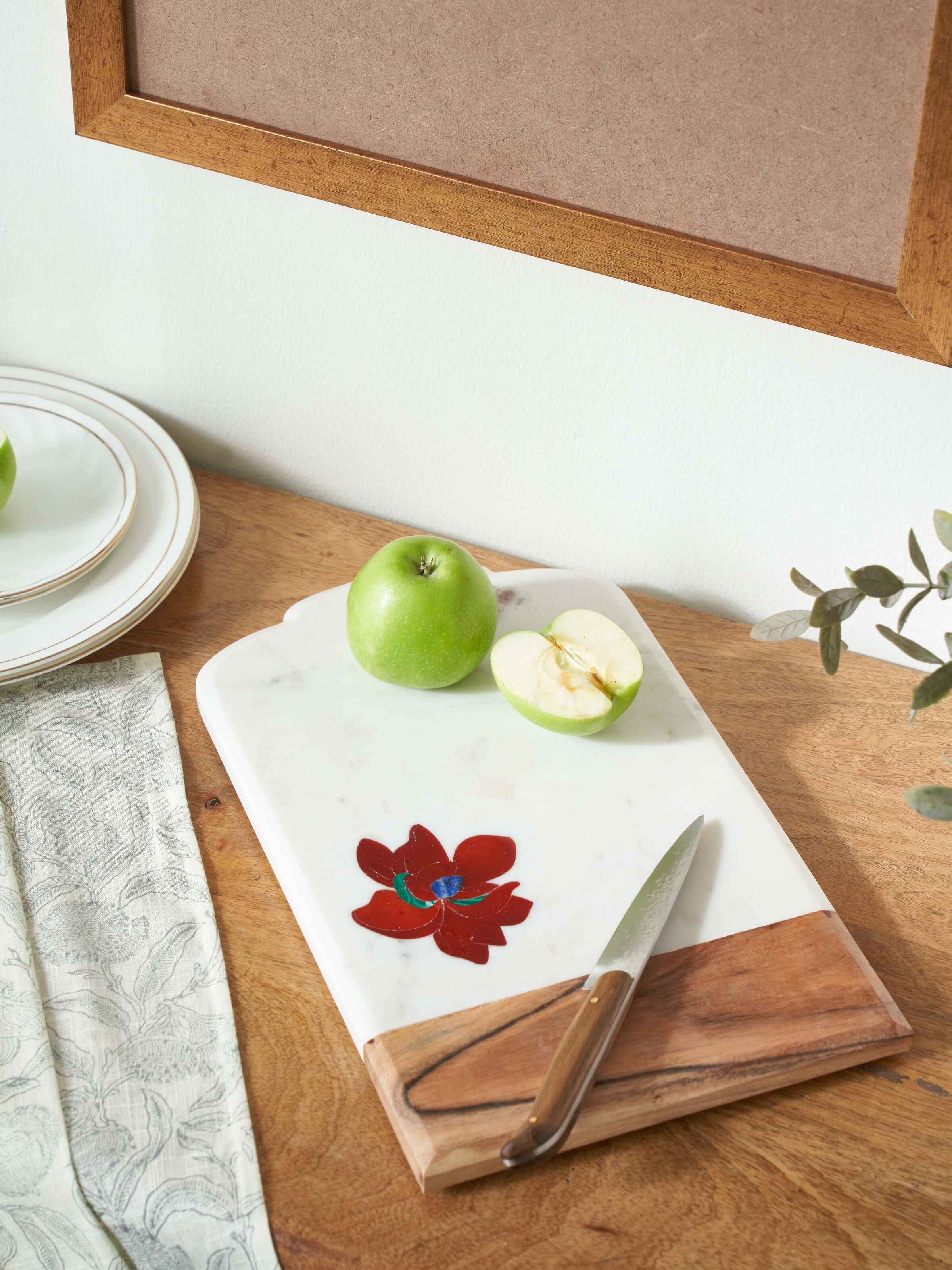 Close-up view of the marble and coloured stone chopping board, showcasing the texture and craftsmanship.