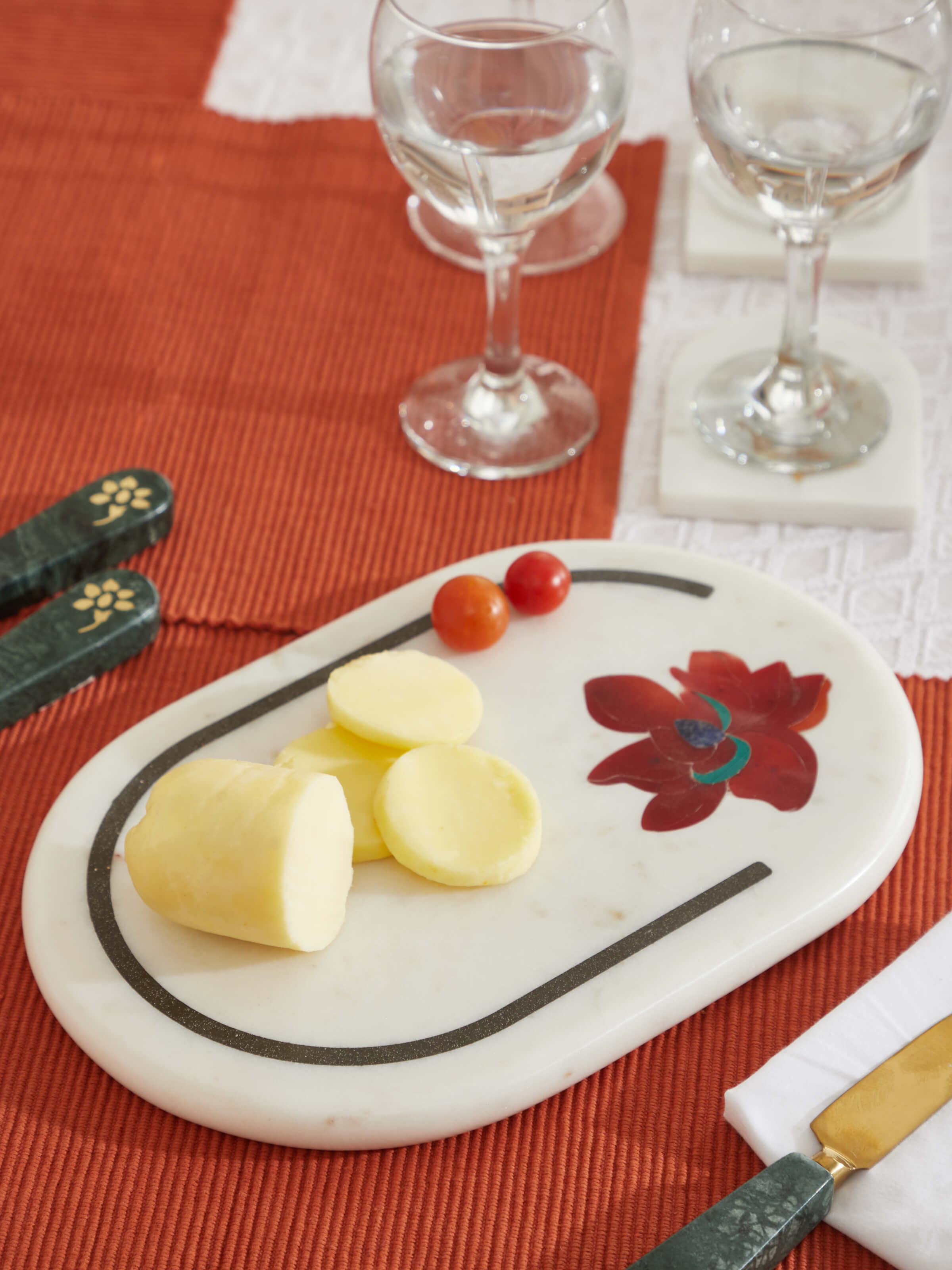 Side view of Marble & coloured stone cheese board showcasing the polished finish and detailed edge work.