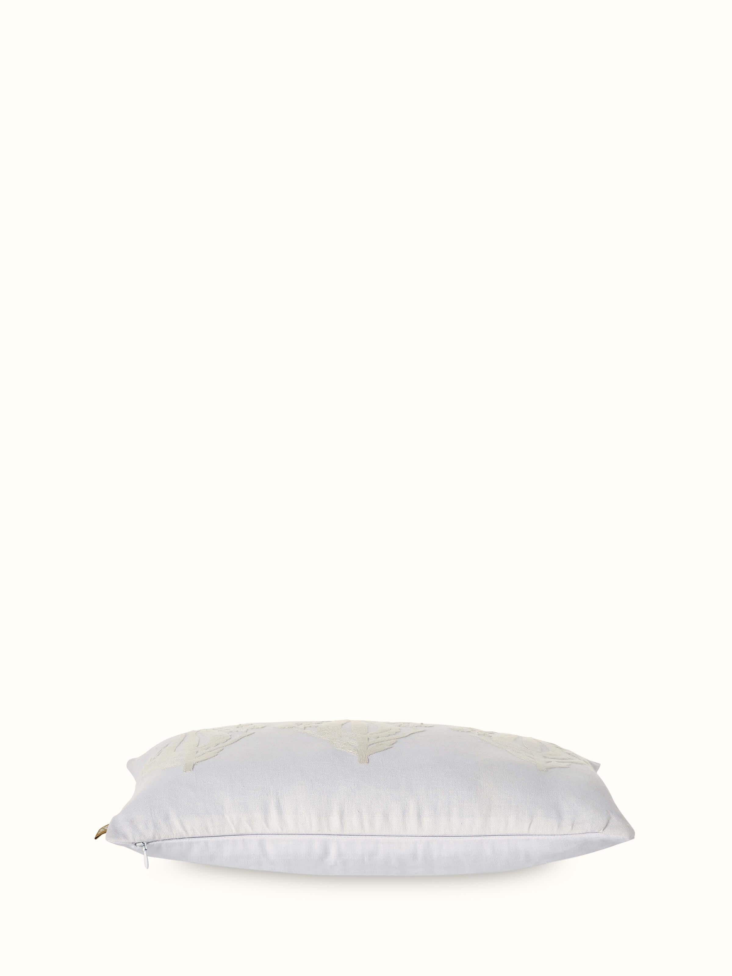 Angled view highlighting hand-embroidered tulip motifs in vibrant threadwork