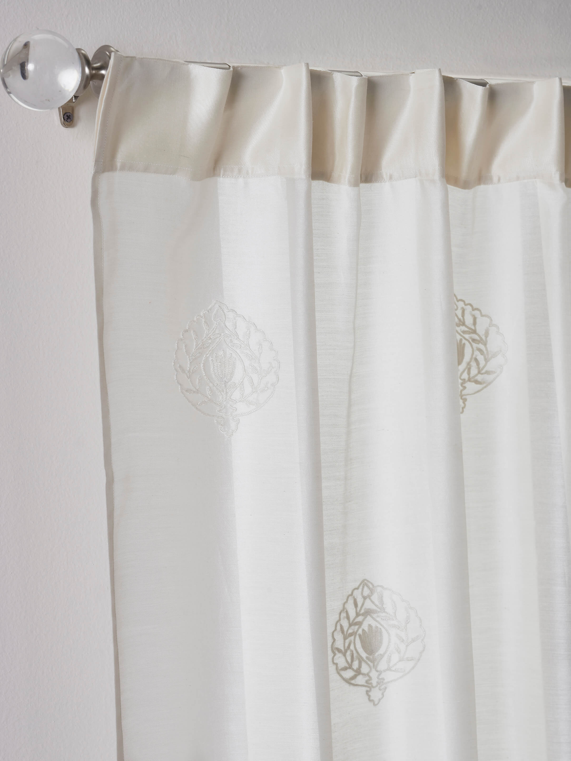 A front view of the Razza Ivory Buti Cotton Silk Kashmir Sheer Curtain in a seven-foot length, featuring traditional chain stitch hand embroidery and semi-transparent texture.