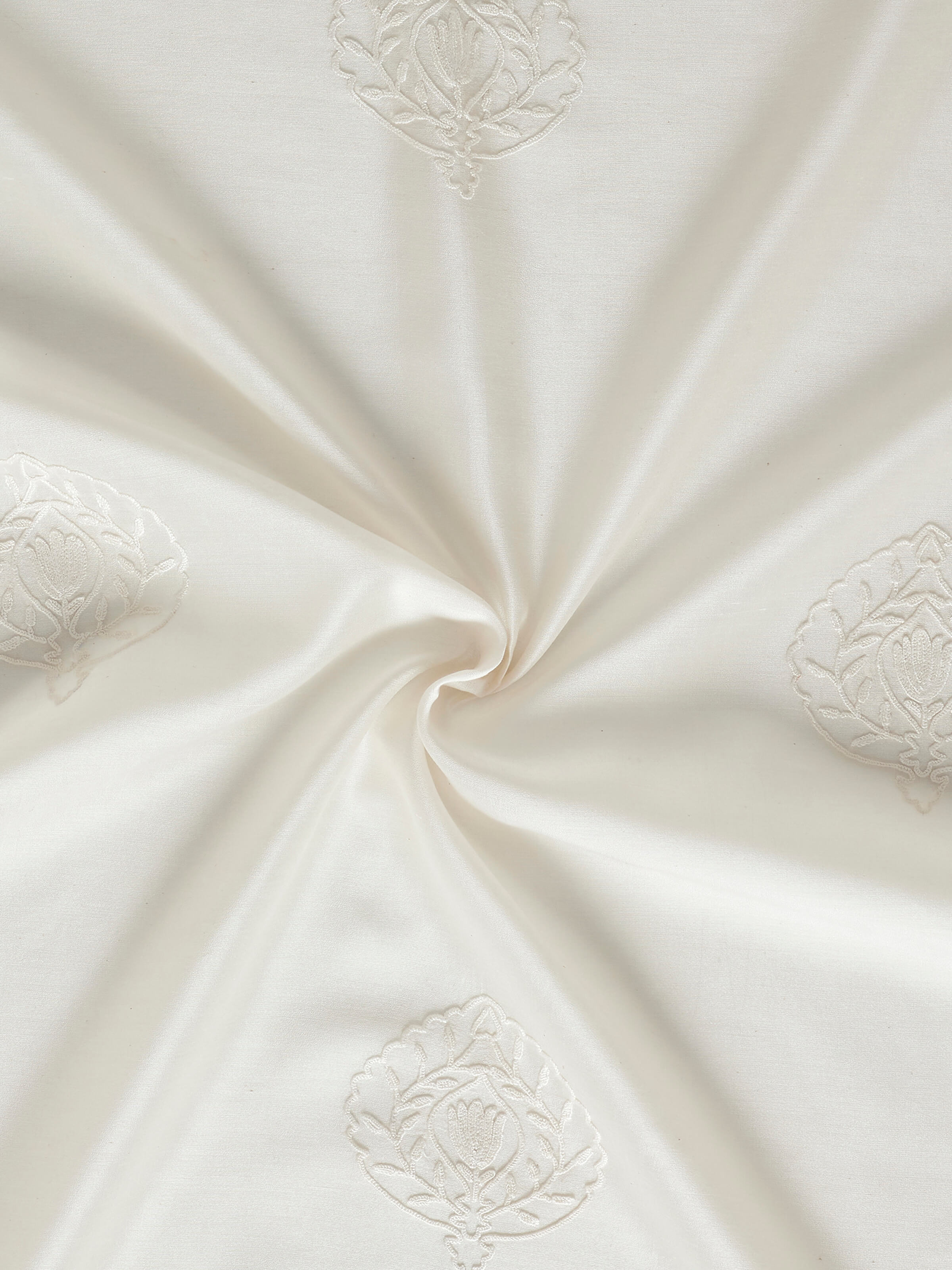 A close-up view of the intricate Buti design and chain stitch embroidery on the Razza Ivory Cotton Silk Sheer Curtain, reflecting traditional Kashmiri needlework.