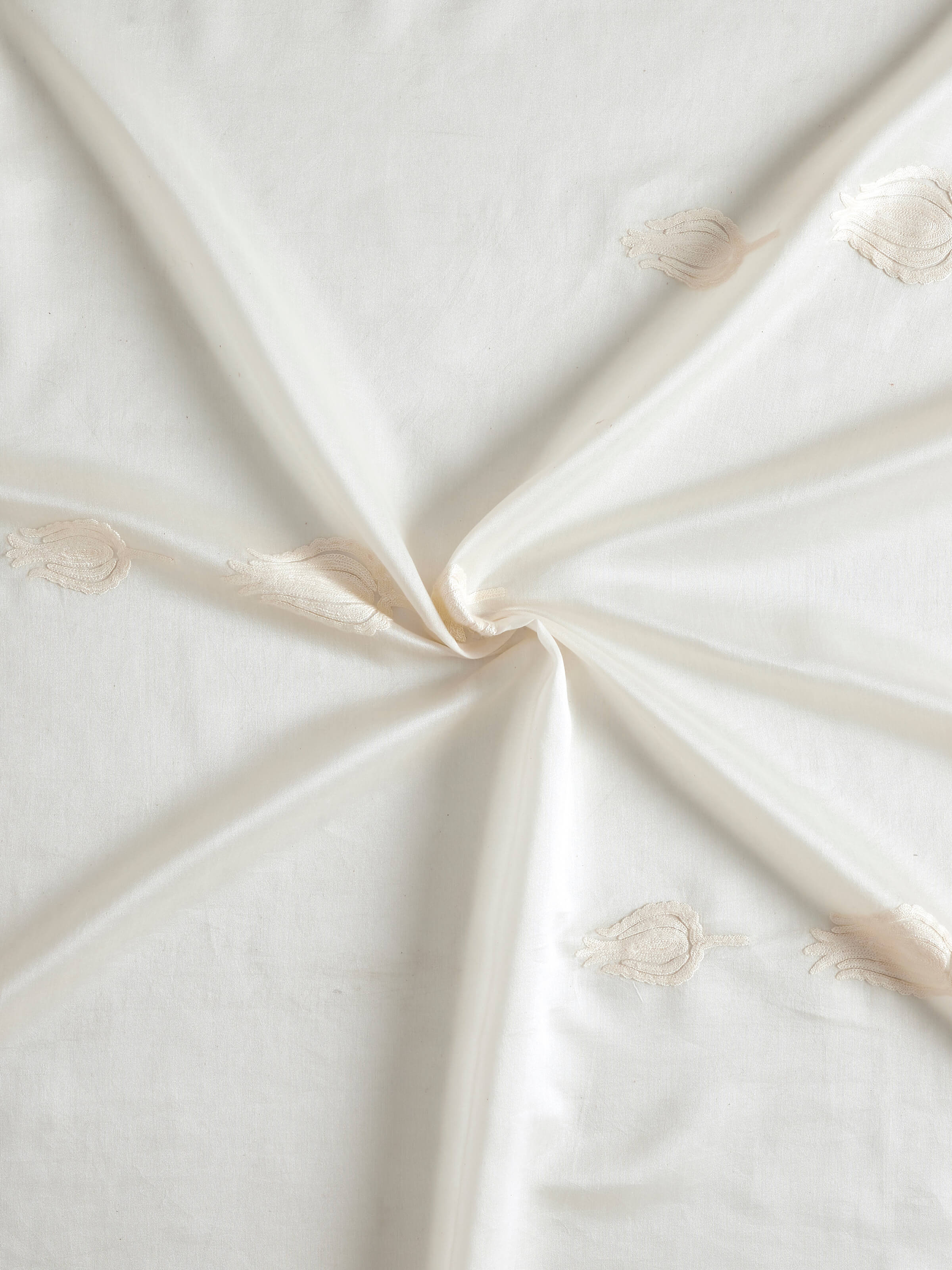 Full view of Razza ivory tulip buti cotton silk crewel hand embroidered sheer curtain displaying the overall design and sheer fabric.