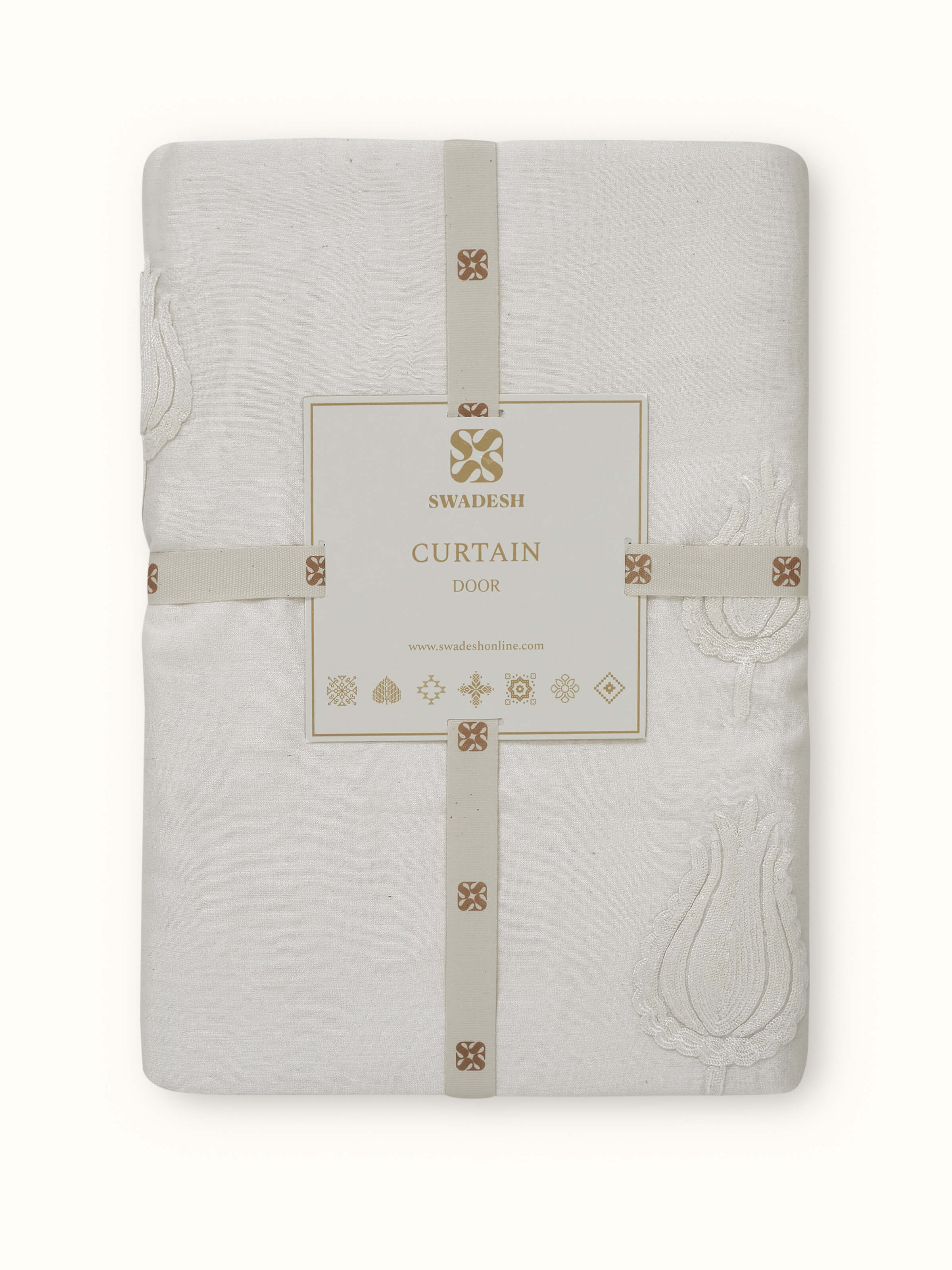 Detail shot of chain stitch embroidery in tulip motifs on cotton silk sheer fabric.