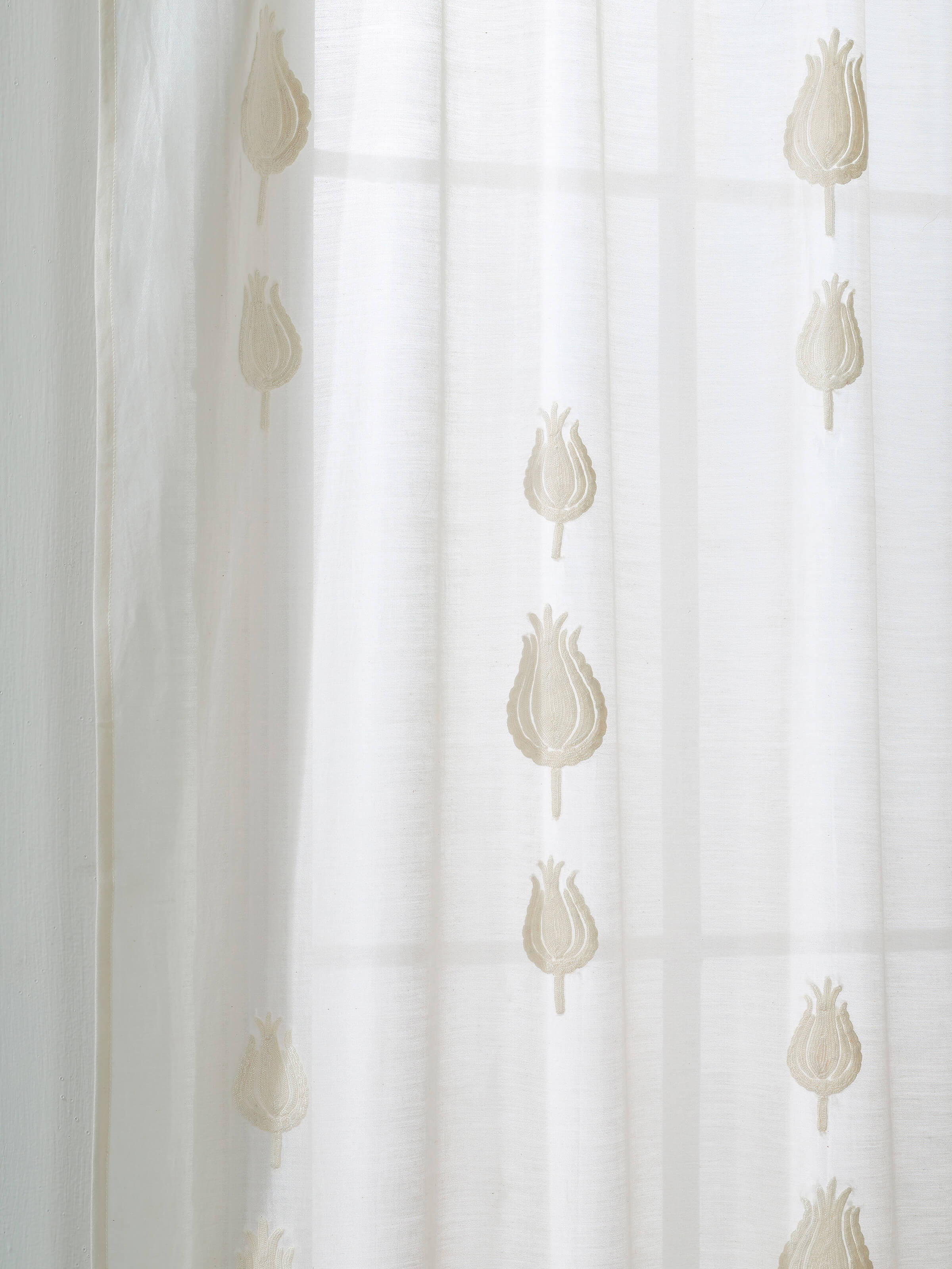 Detail shot of floral embroidery from a close range showing needlework precision.