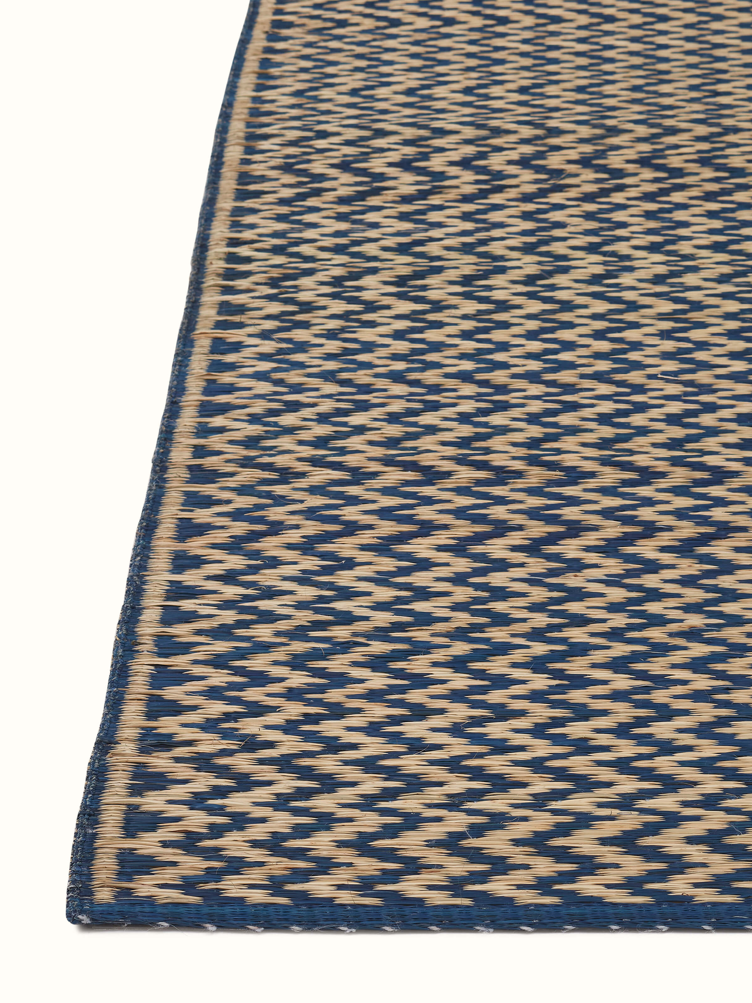 Detailed view of Folk geo dark turquoise West Bengal madurkathi natural fibre mat highlighting its pattern and texture.