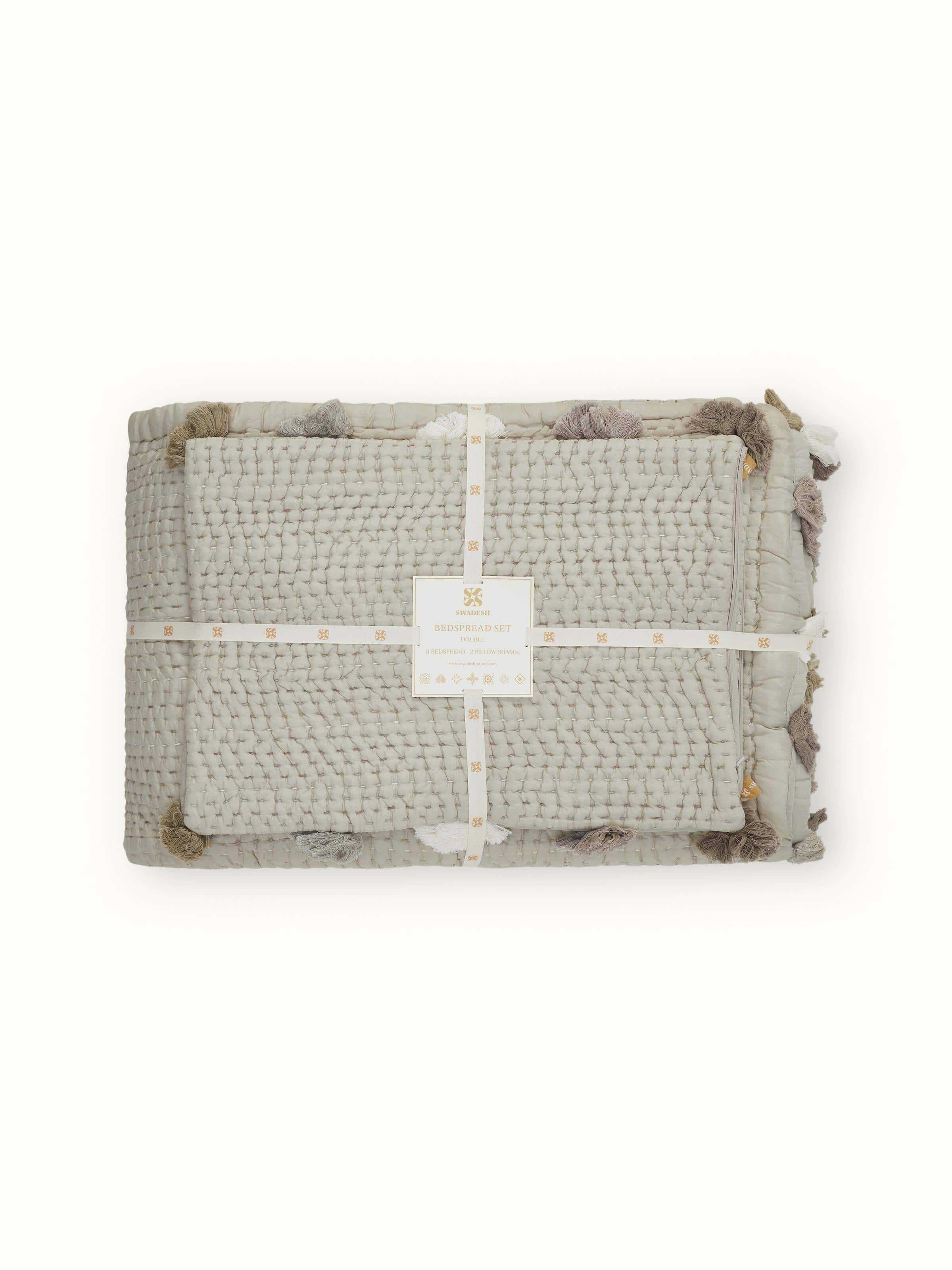 Close-up of Ahilya grey textured silk razai embroidered double bedspread set, emphasizing the details of the embroidery and silk texture.