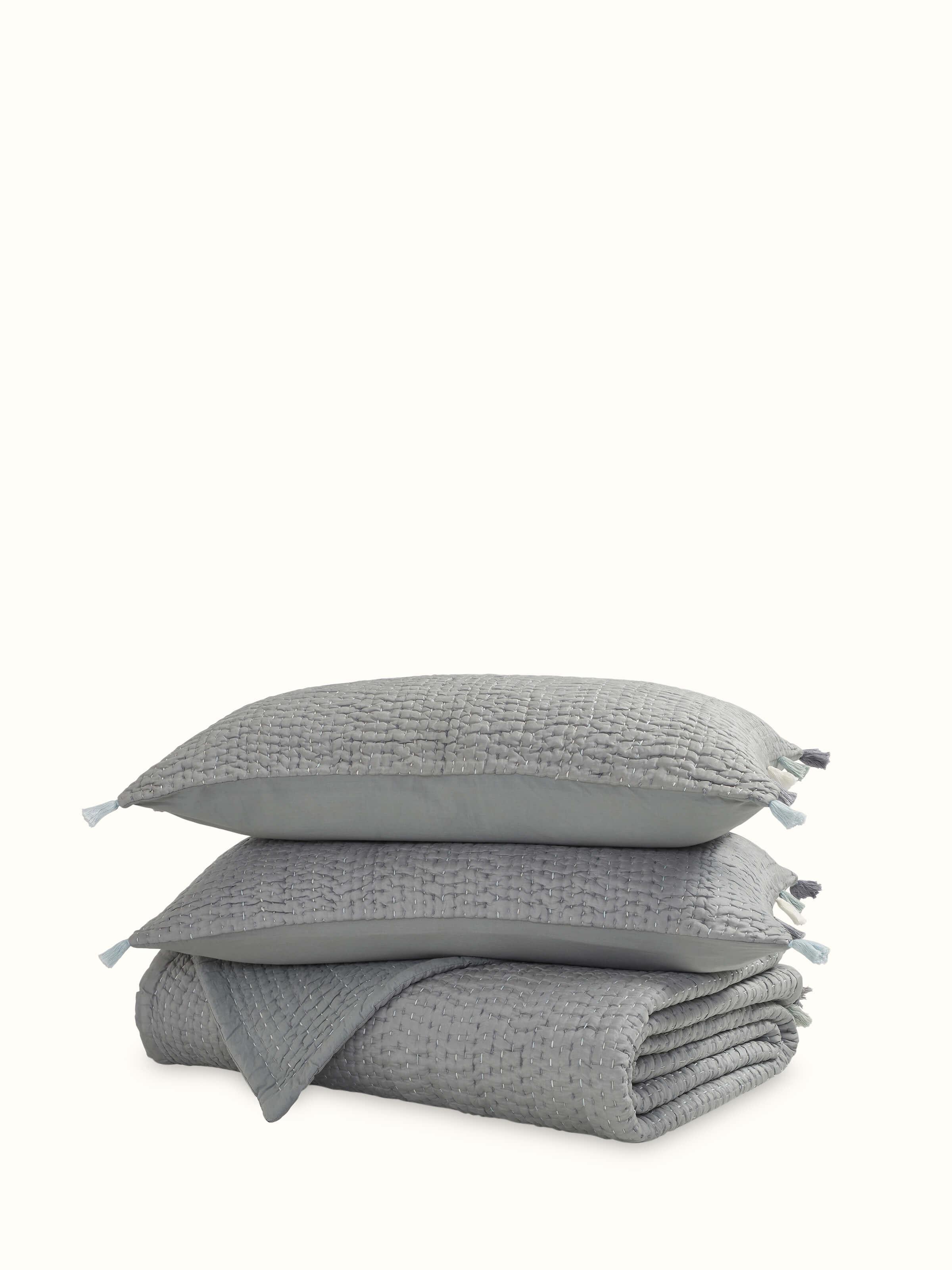 Full view of dark grey textured silk razai embroidered double bedspread set, showcasing the intricate embroidery and luxurious silk texture.
