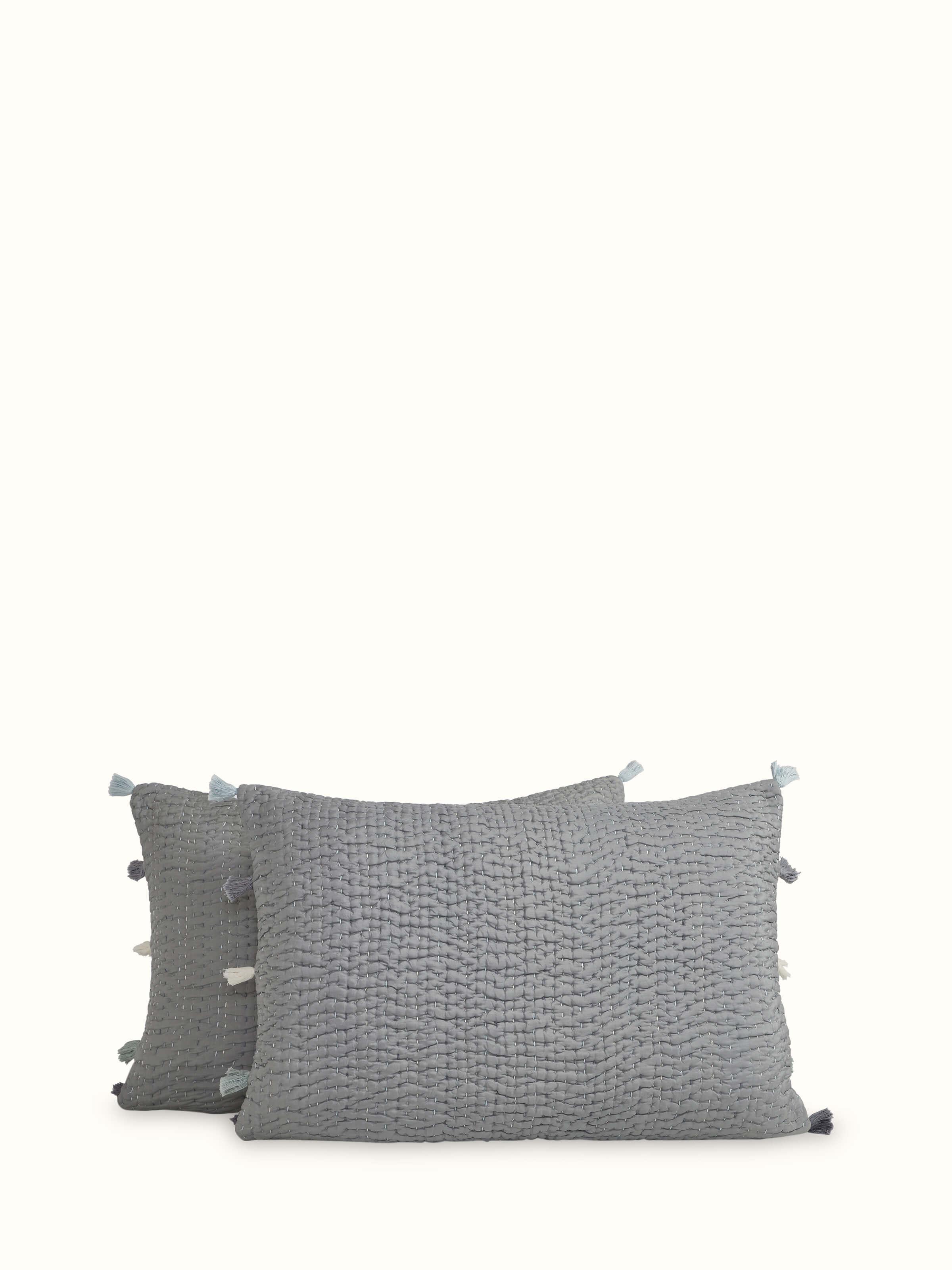 Angled view of dark grey textured silk razai embroidered double bedspread set, showing the overall design and luxurious texture.