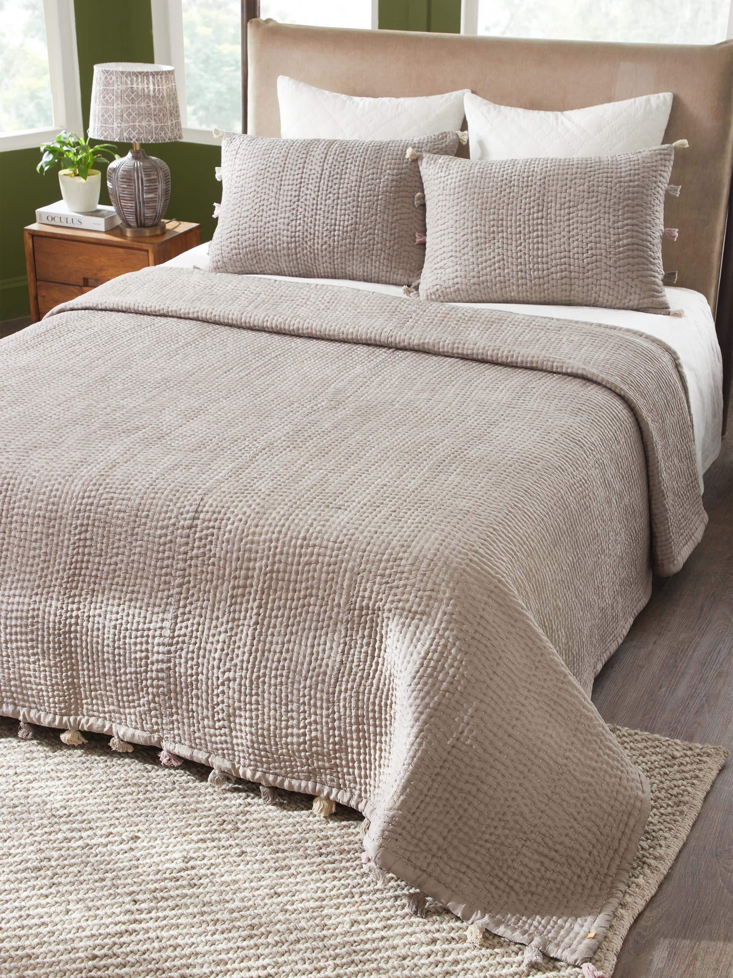 Close-up of brown textured silk razai embroidered double bedspread set, highlighting the fine embroidery details and rich fabric.