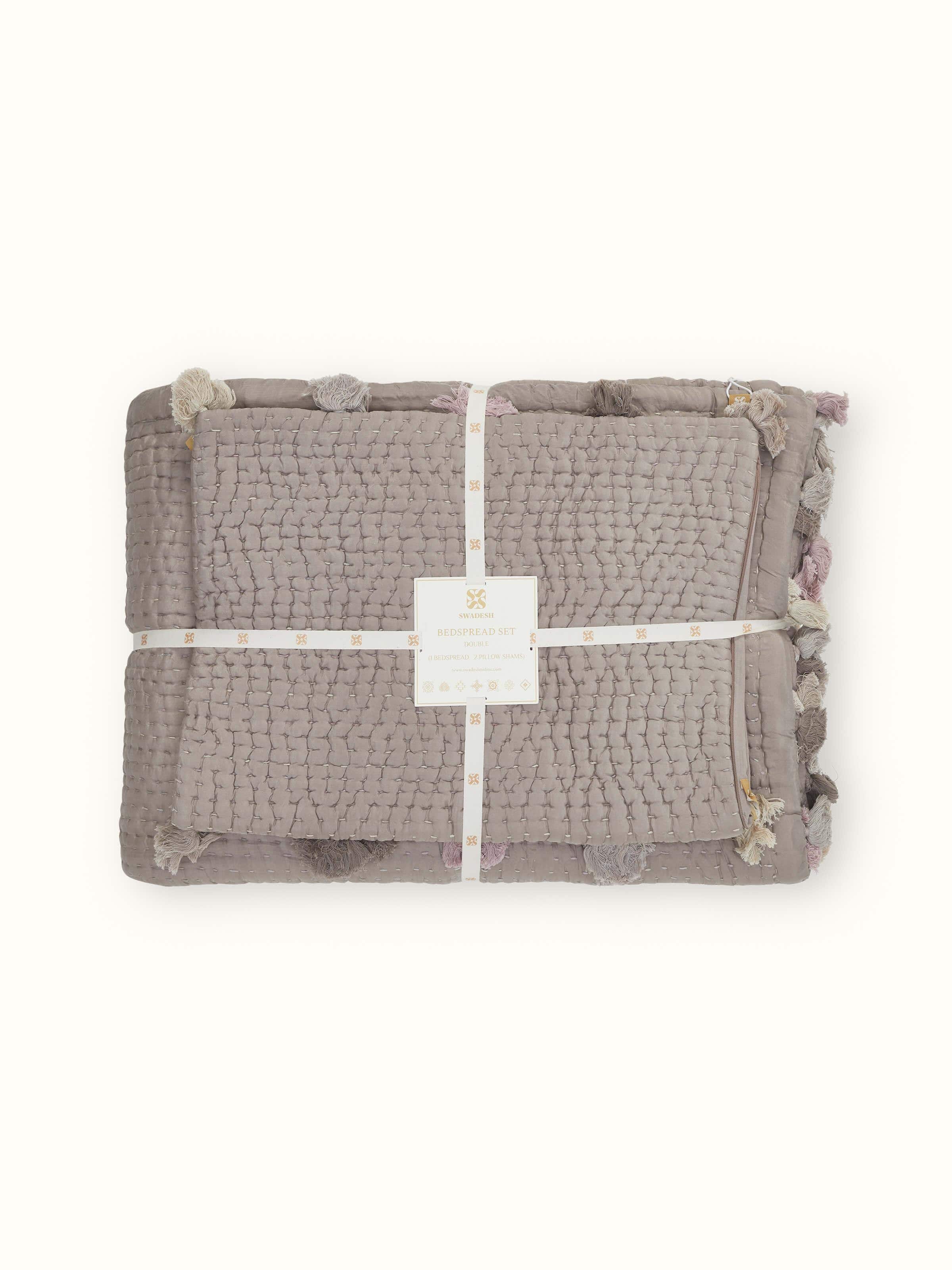 Detailed view of brown textured silk razai embroidered double bedspread set, highlighting the craftsmanship and design elegance.