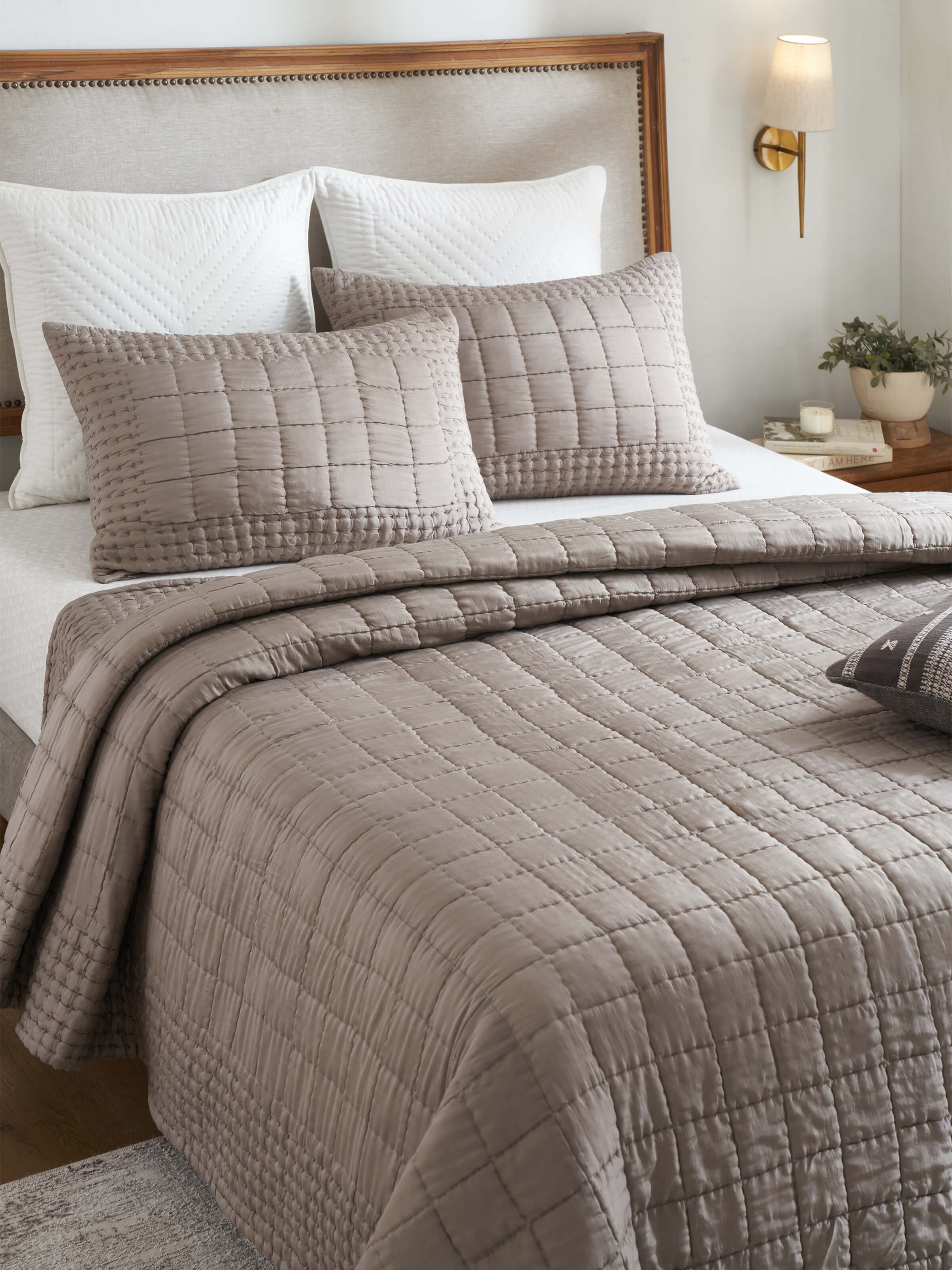 Close-up of Pipa Grey Solid Silk Razai Embroidered Bedspread Set emphasizing the fine embroidery detail on the silk fabric.