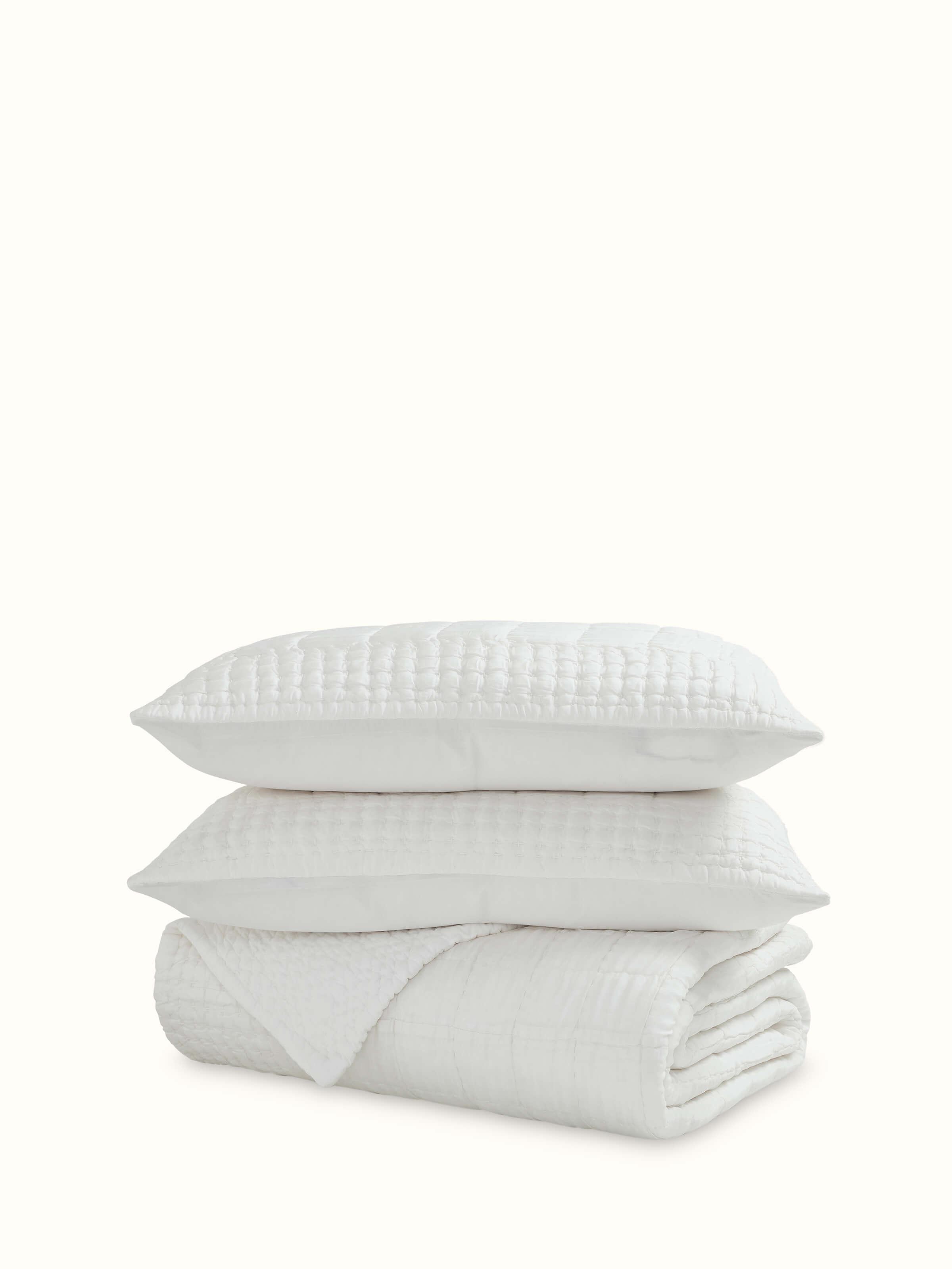 Front view of Pipa ivory solid silk razai embroidered double bedspread set (3 pcs) highlighting its elegant embroidery.