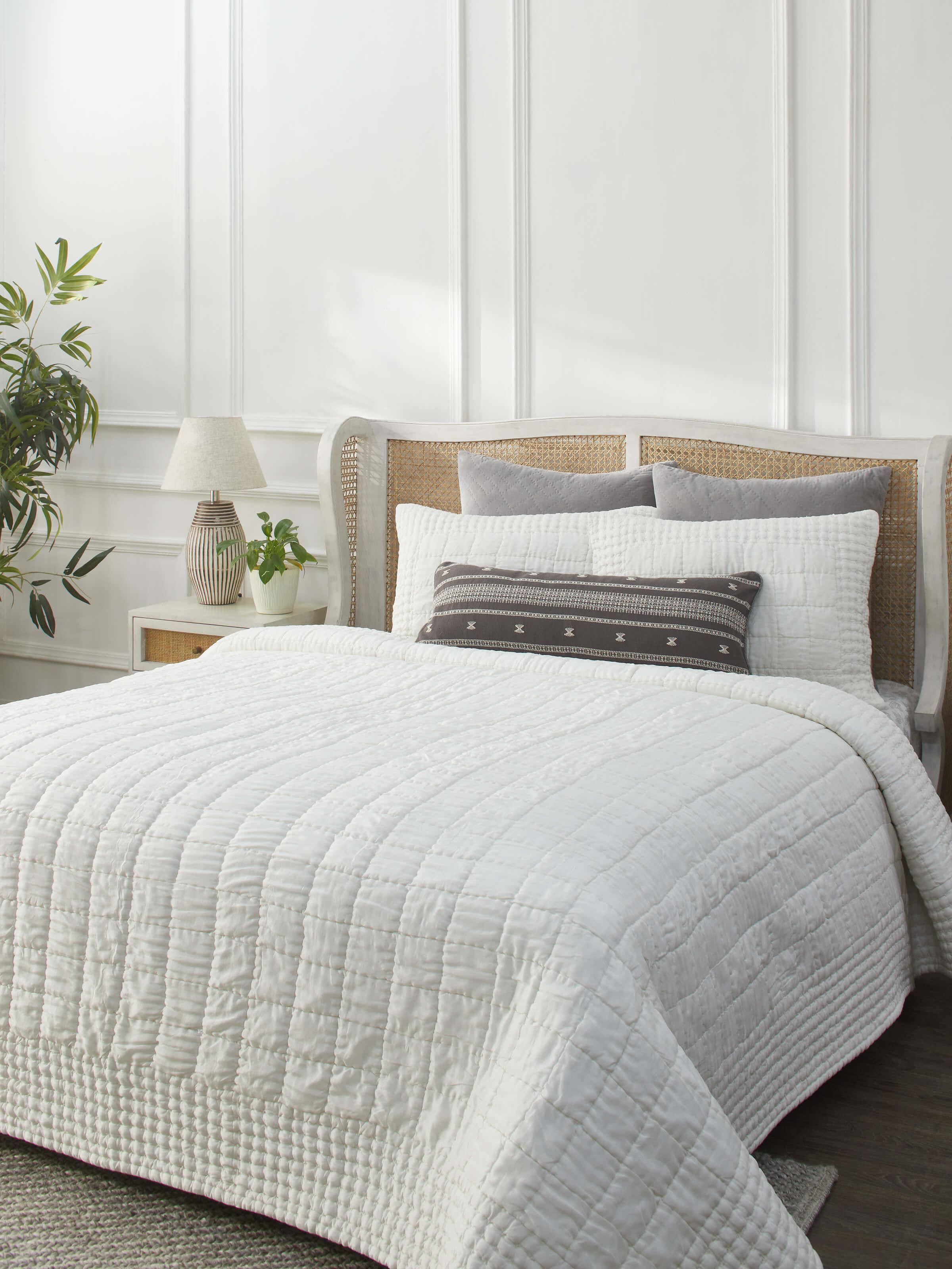 Close-up of Pipa ivory solid silk razai embroidered double bedspread set (3 pcs) focusing on the detailed embroidery.
