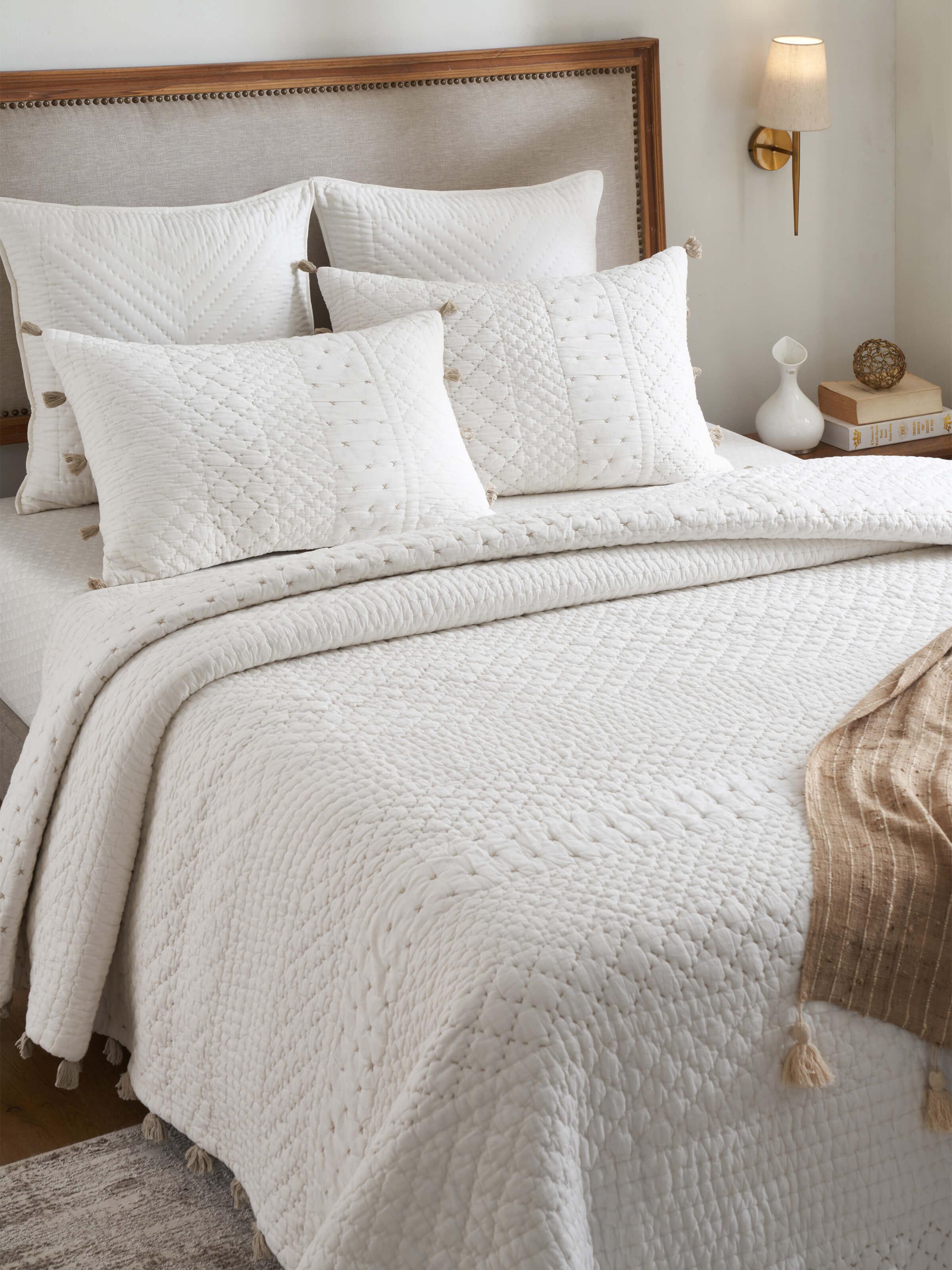 Close-up of Nitya off-white textured stripe cotton razai embroidered double bedspread set showing the detailed embroidery and stripe pattern