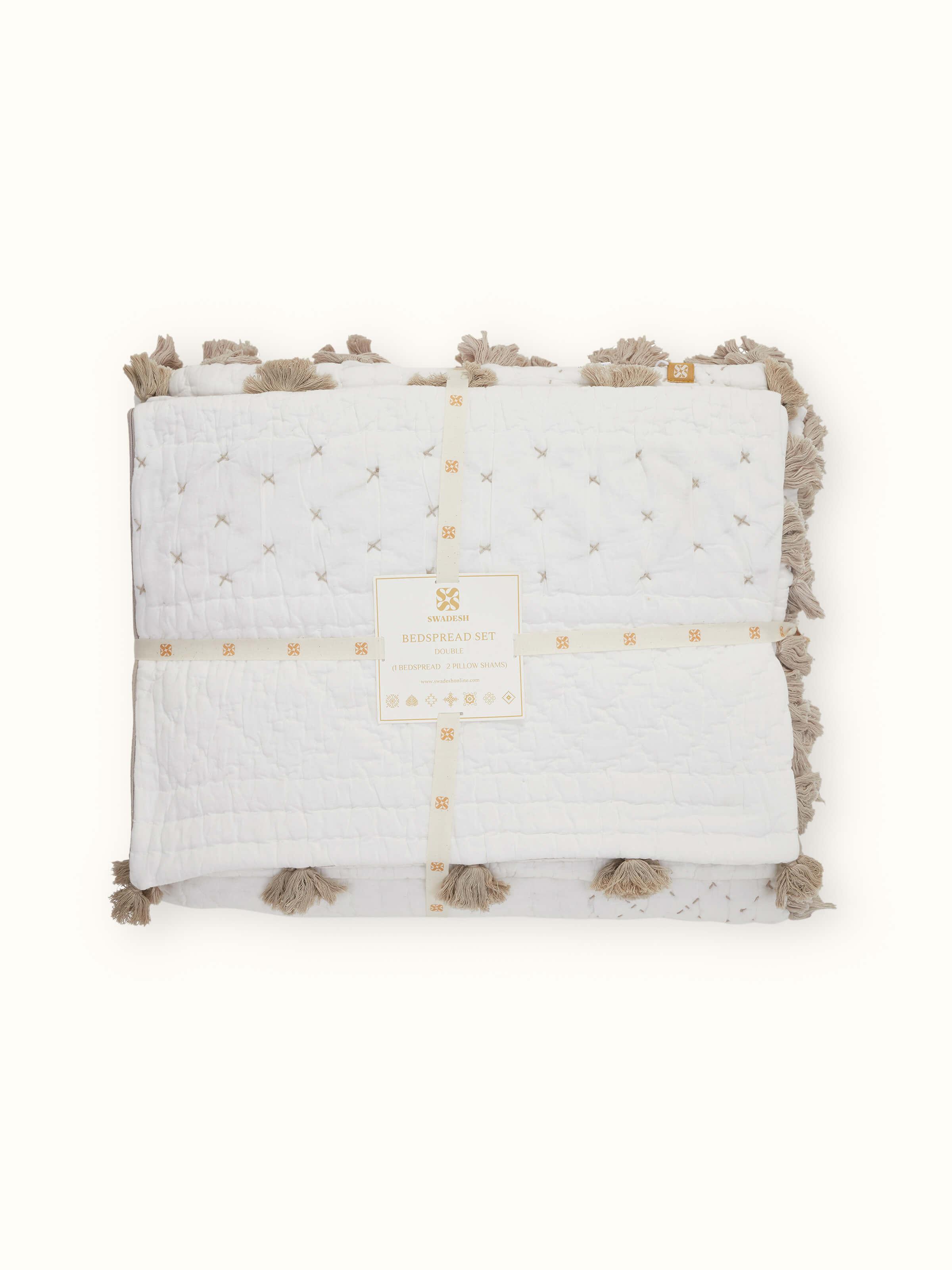 Top view of Nitya off-white textured stripe cotton razai embroidered double bedspread set displaying the complete layout and embroidered details