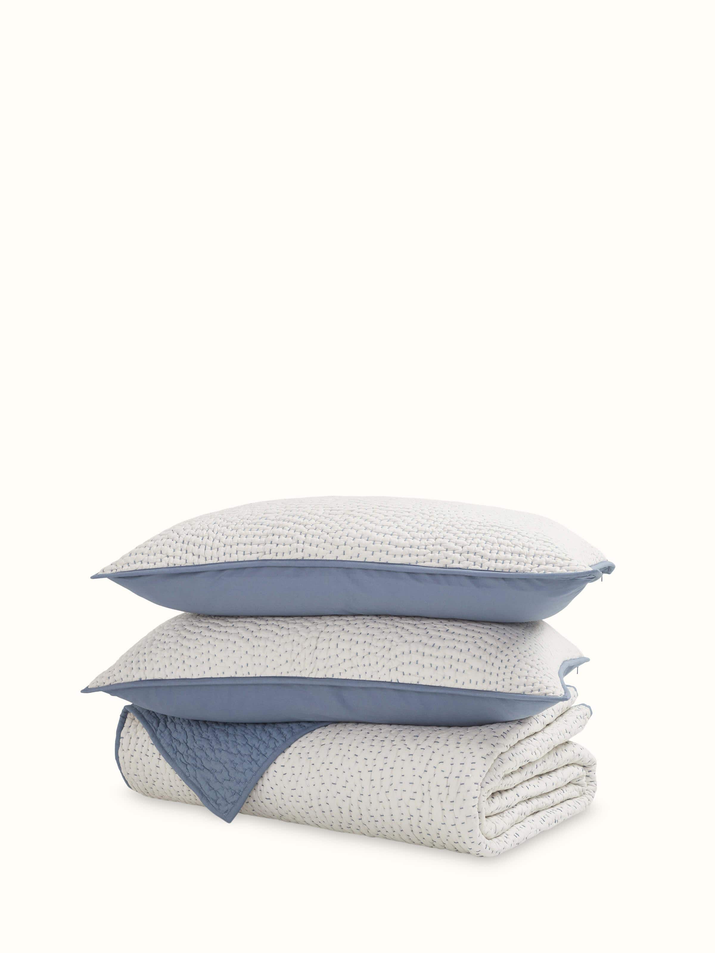 Front view of a beige two-tone textured cotton razai embroidered double bedspread set, highlighting the intricate embroidery and two-tone textured design.