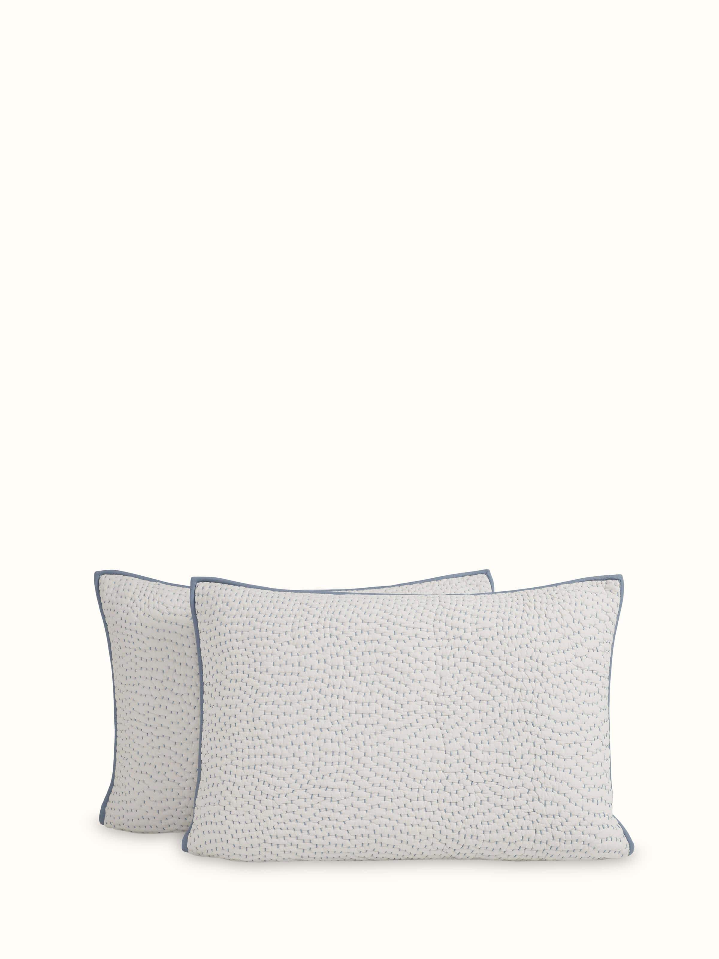 Angled view of a beige two-tone textured cotton razai embroidered double bedspread set, showcasing the elegant design and detailed embroidery.