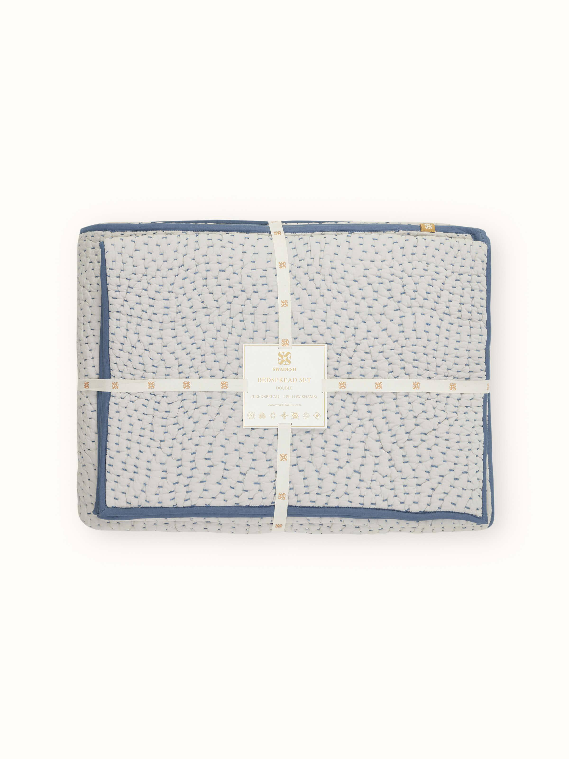 Close-up view of the double bedspread set, focusing on the two-tone texture and fine embroidery details.