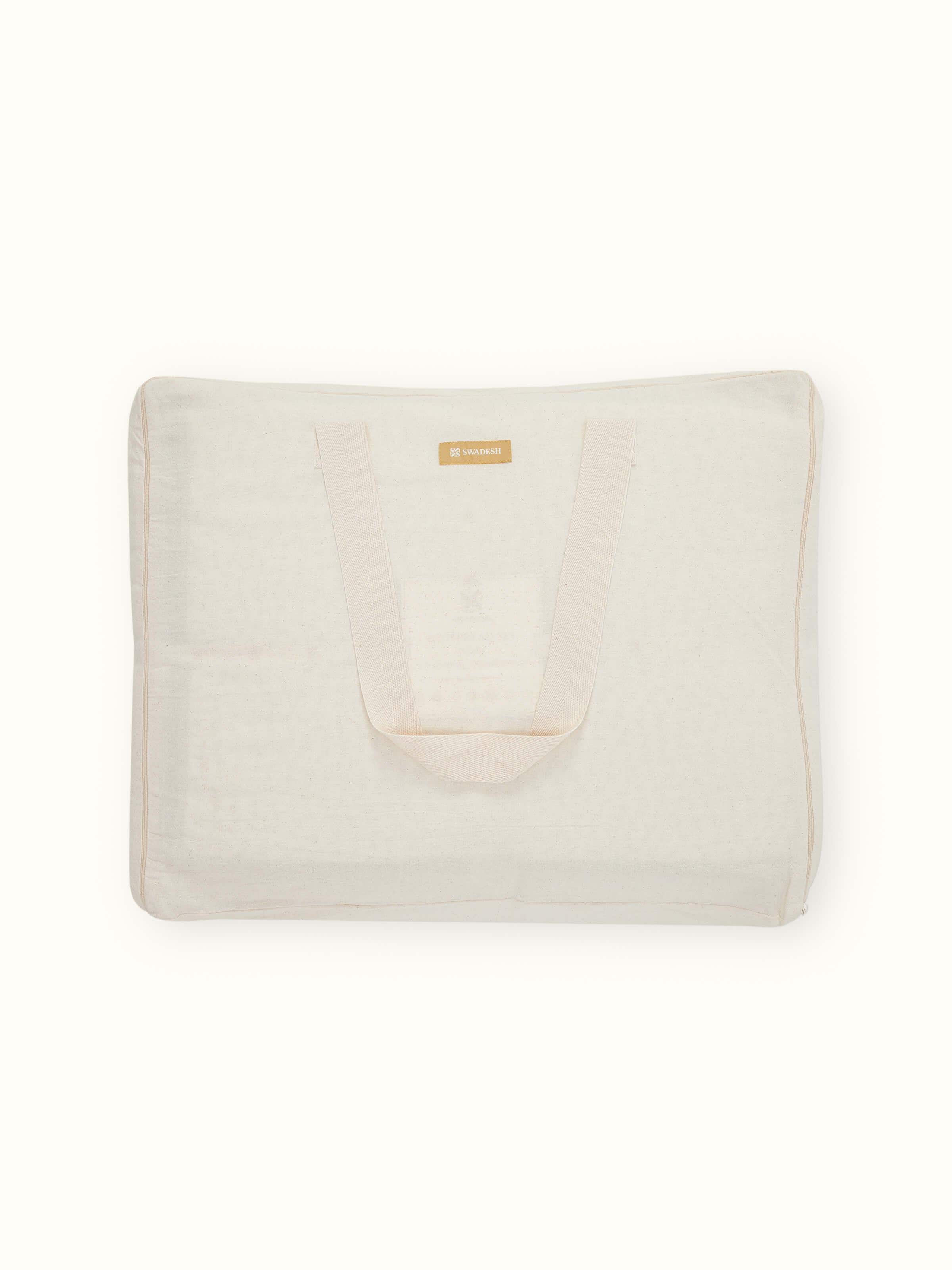 Detailed view of Nityam Ivory Two-Tone Textured Cotton Razai Embroidered Double Bedspread Set showcasing embroidery and texture.