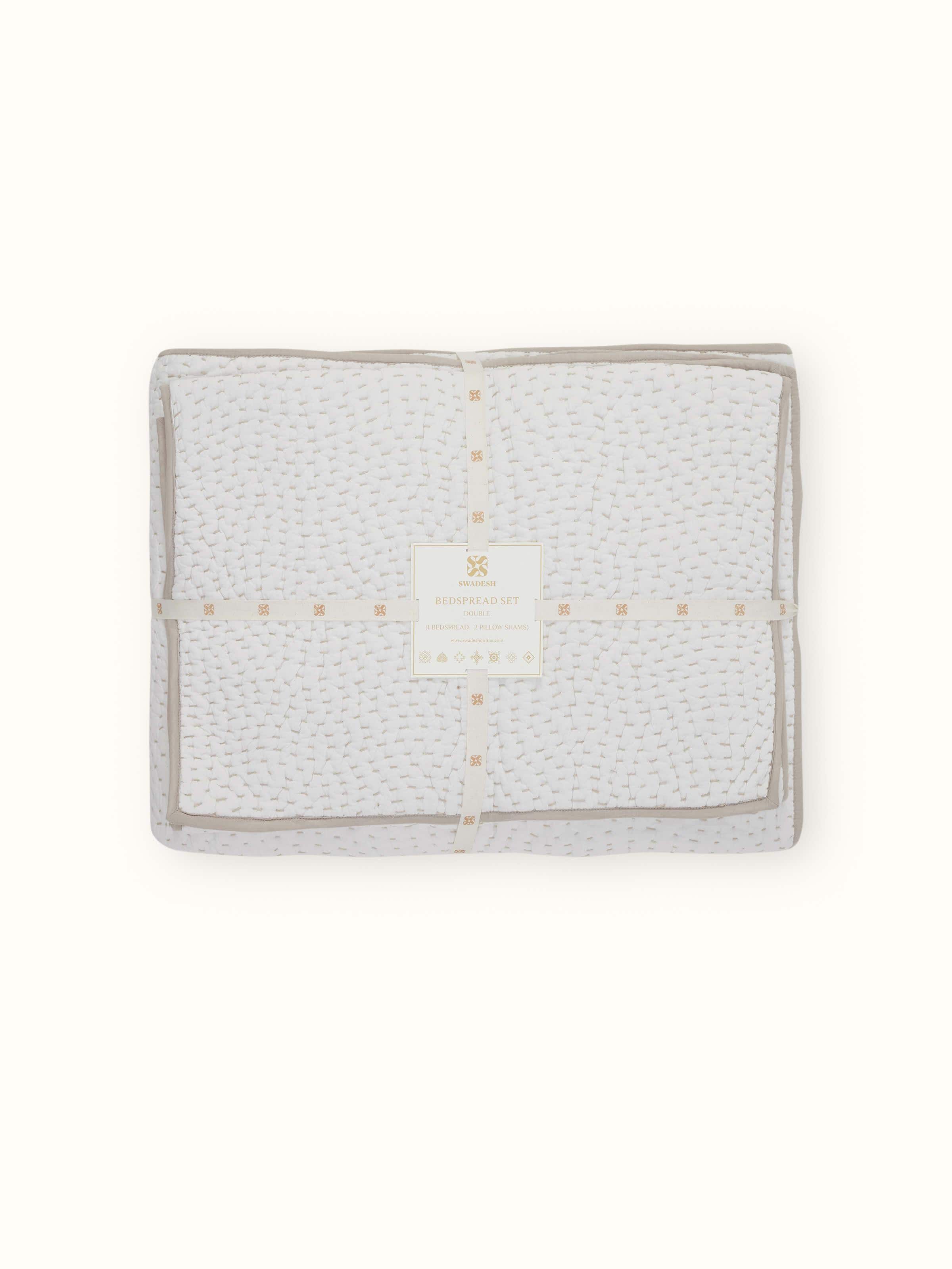 Close-up of Nityam Ivory Two-Tone Textured Cotton Razai Embroidered Double Bedspread Set highlighting the fabric’s texture.