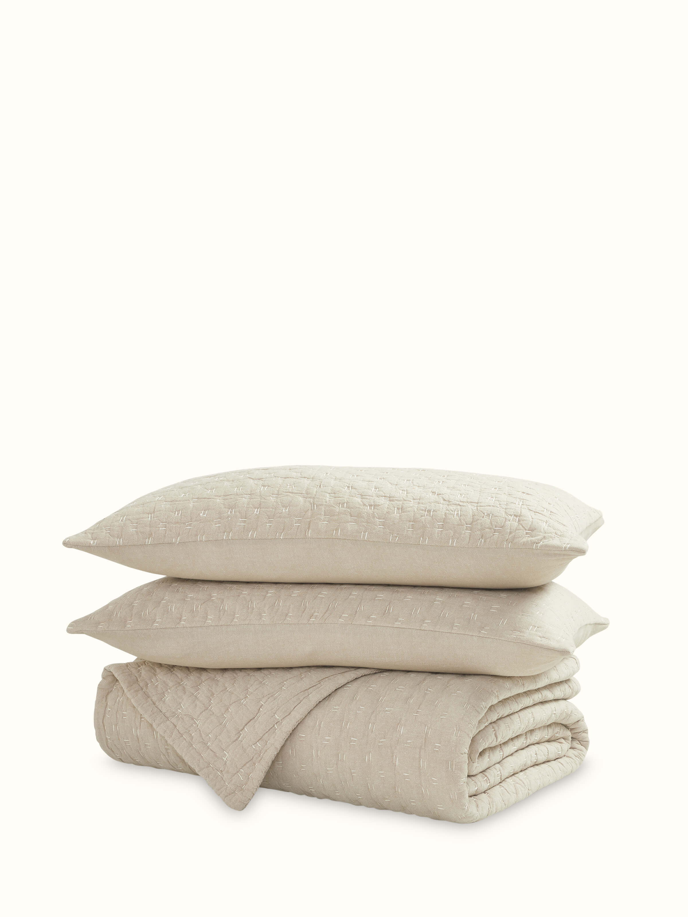 Front view of Vaayu beige chambray textured cotton razai embroidered double bedspread set highlighting the elegant embroidery