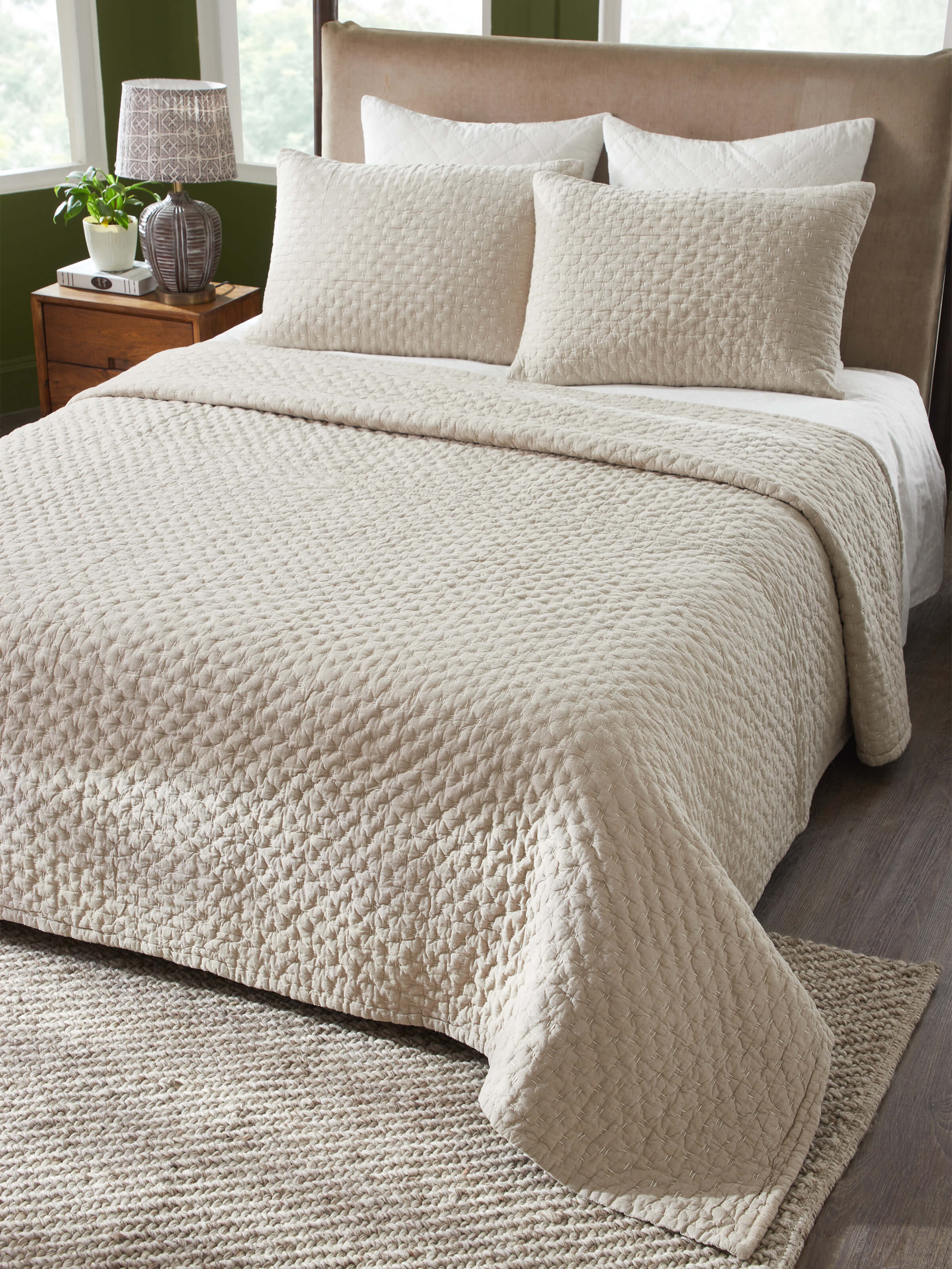 Side view of Vaayu beige chambray textured cotton razai embroidered double bedspread set showing the detailed embroidery