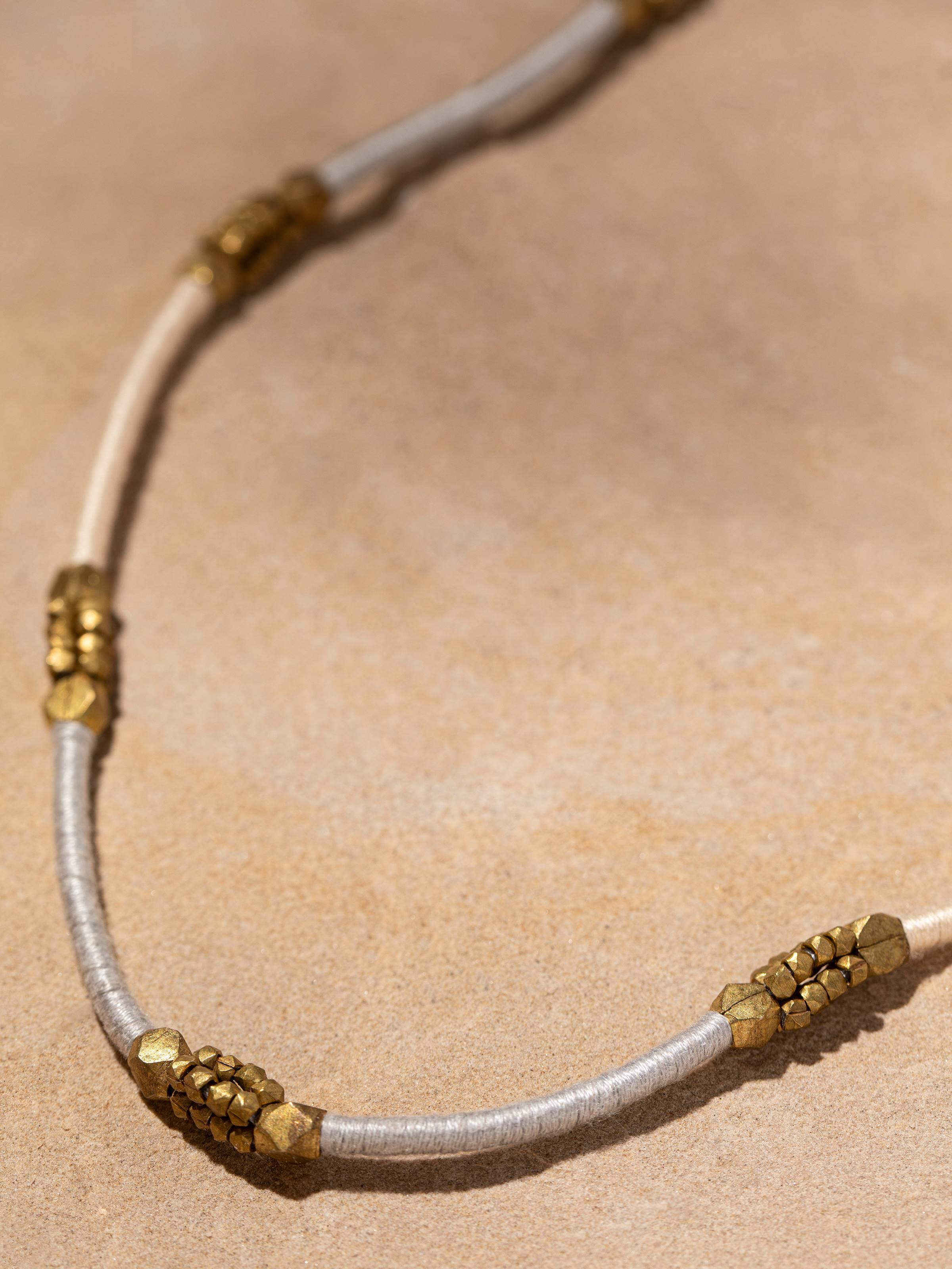 Detailed image of Dhokra Long Necklace emphasizing the intricate Dhokra metalwork and rich detailing.