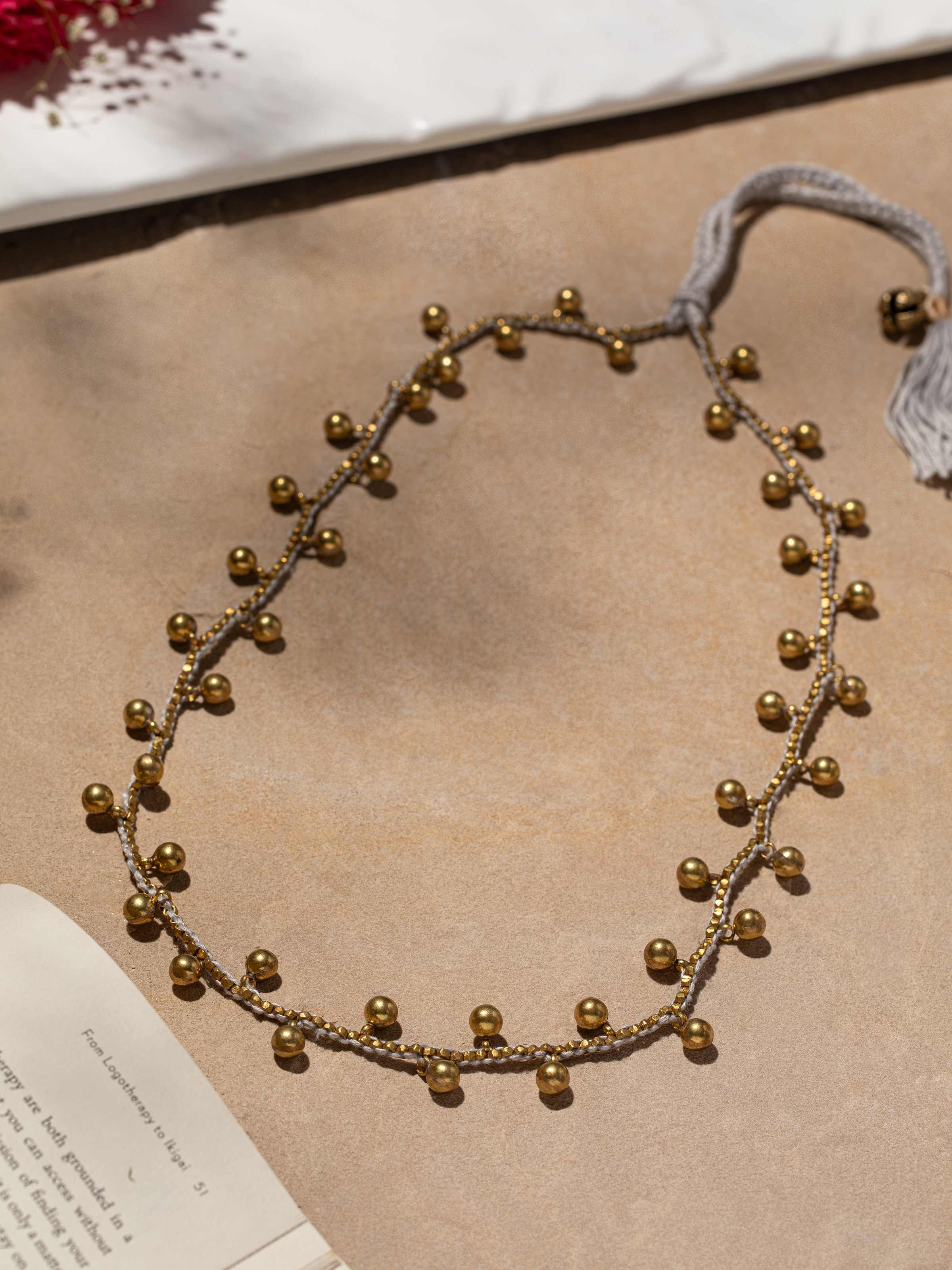 Side view of Dhokra long necklace highlighting its detailed artistry and unique design