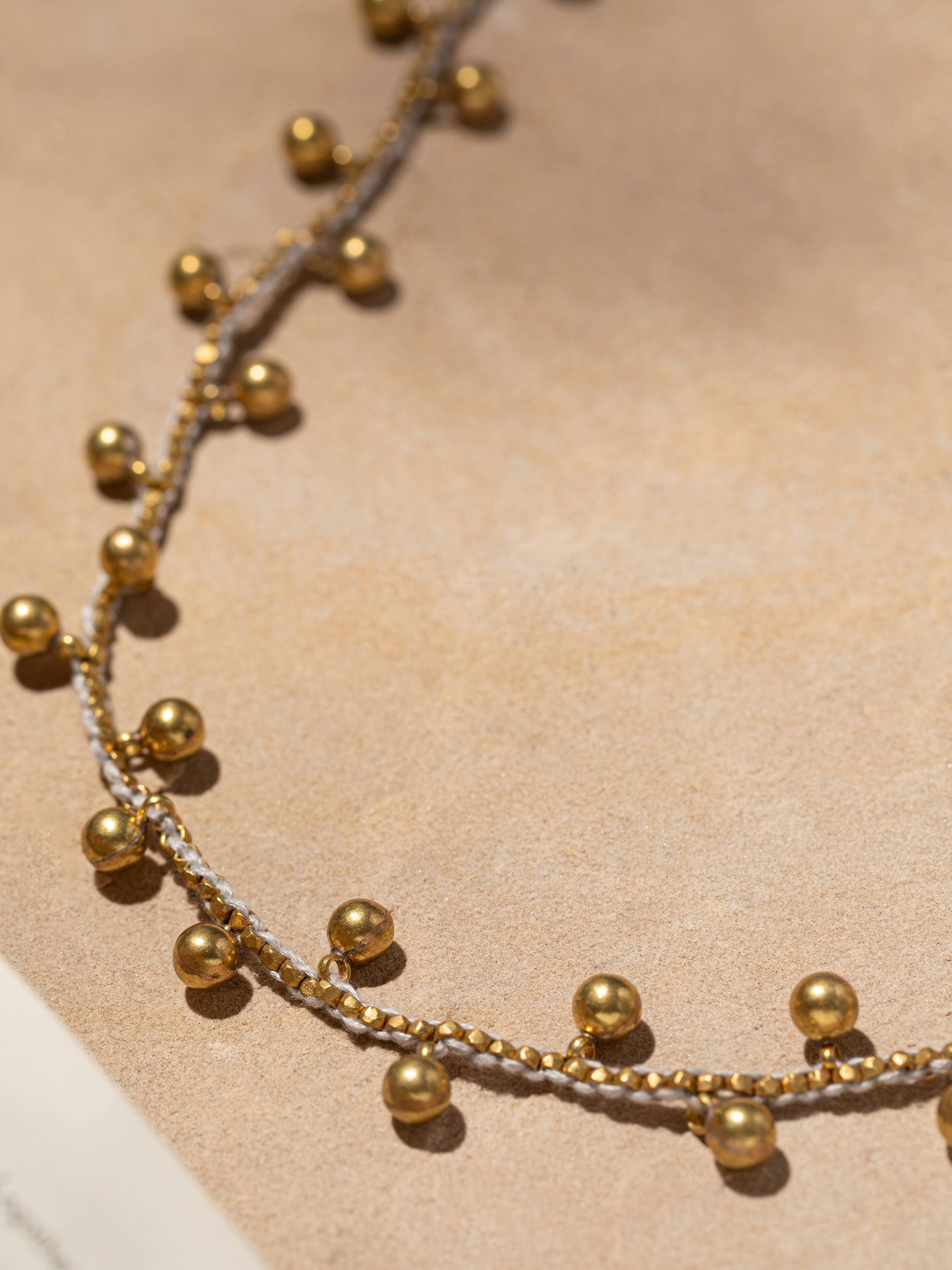 Detailed front view of Dhokra long necklace highlighting its exquisite craftsmanship and traditional design