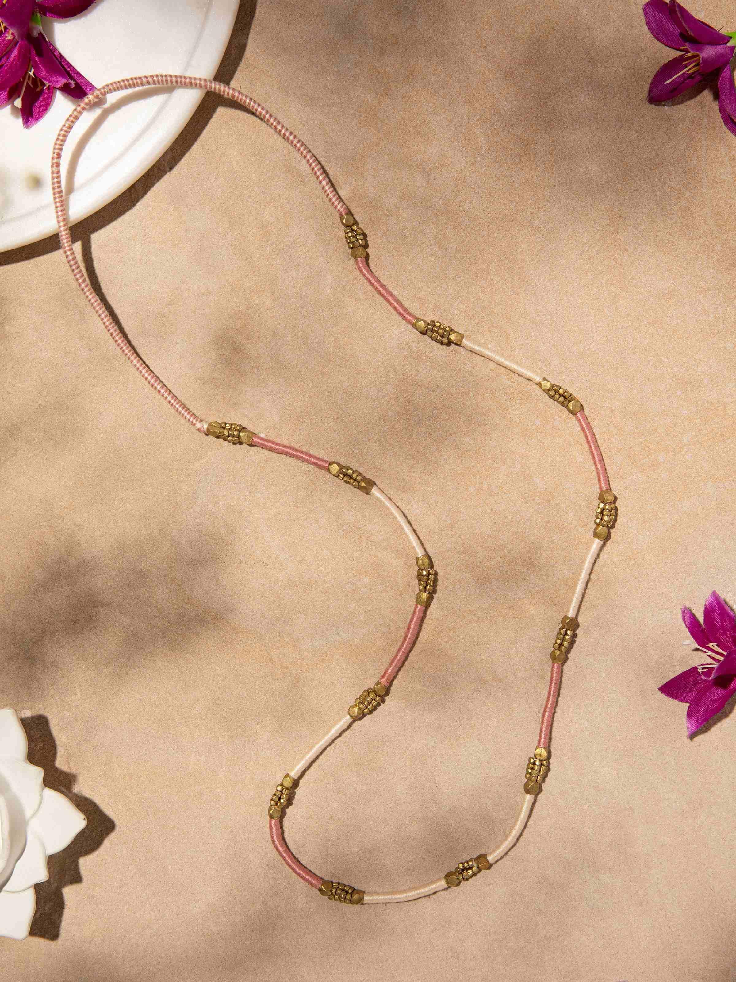 Side view of Dhokra Long Necklace illustrating the detailed design and traditional Dhokra art.