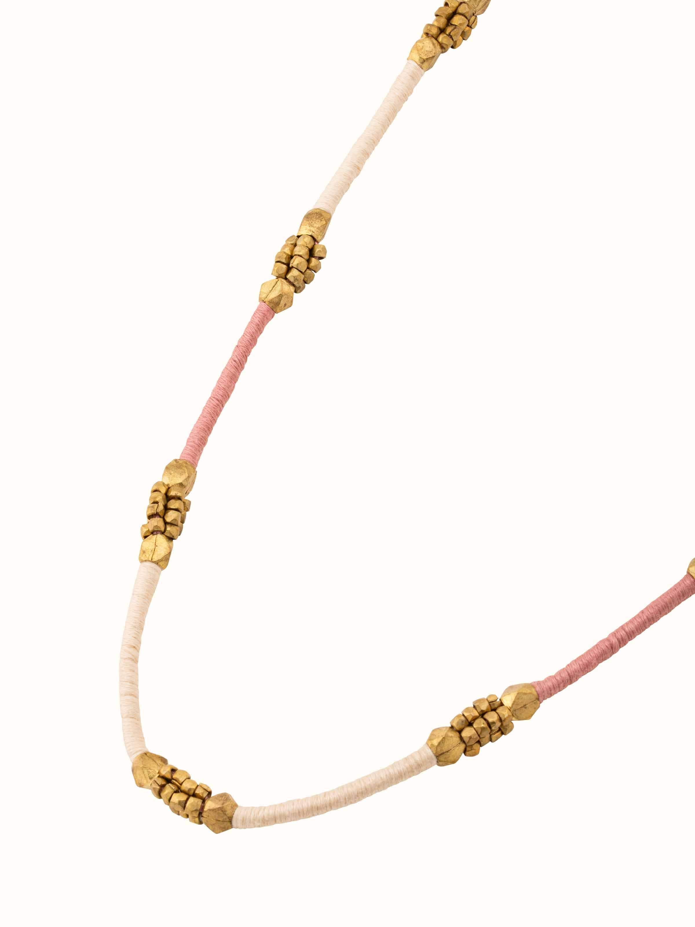 Angled view of Dhokra Long Necklace showcasing the intricate detailing and overall design.