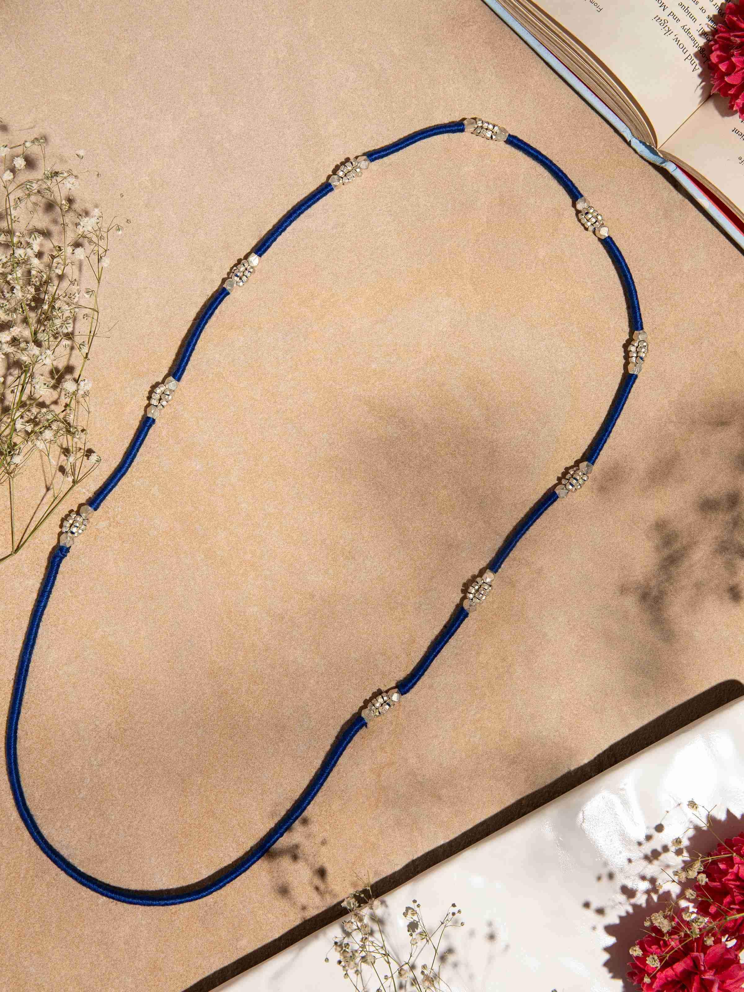 Close-up of Dhokra Long Necklace highlighting the intricate patterns and craftsmanship.