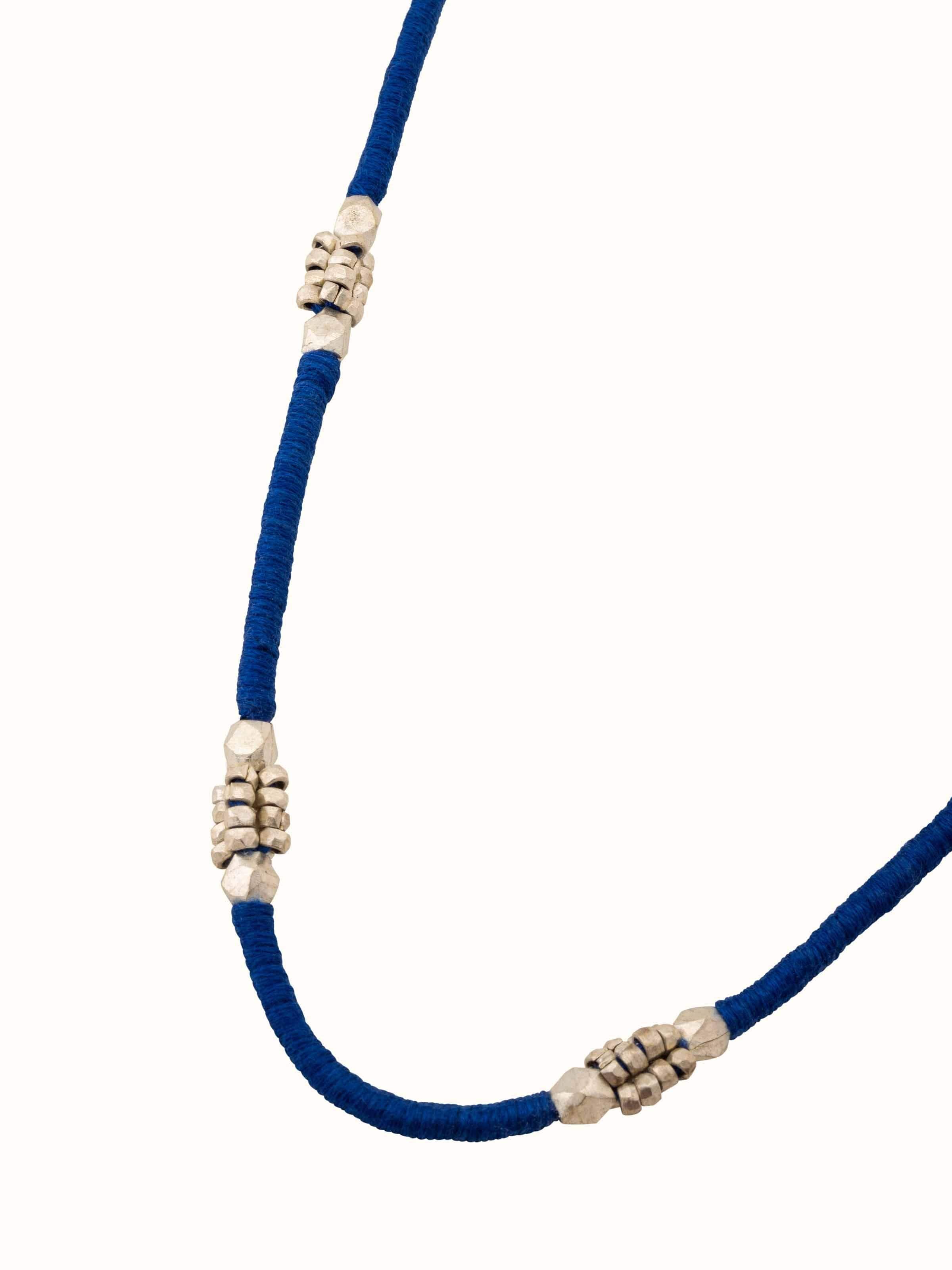 Angled view of Dhokra Long Necklace displaying the detailed Dhokra metalwork and design.