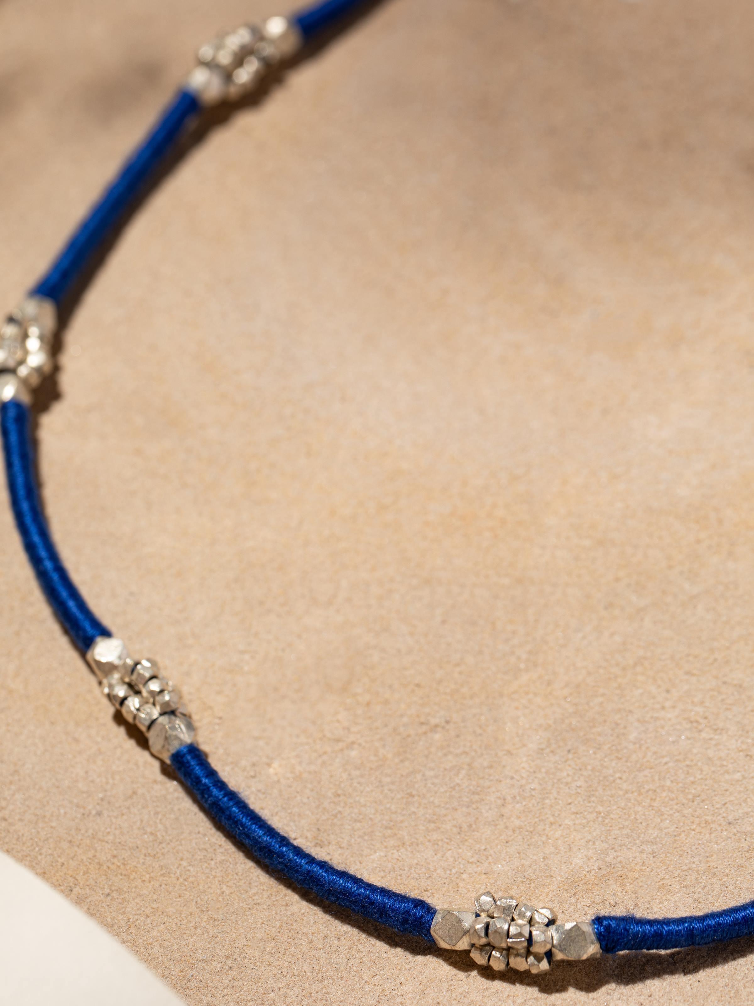 Back view of Dhokra Long Necklace illustrating the clasp and overall design.