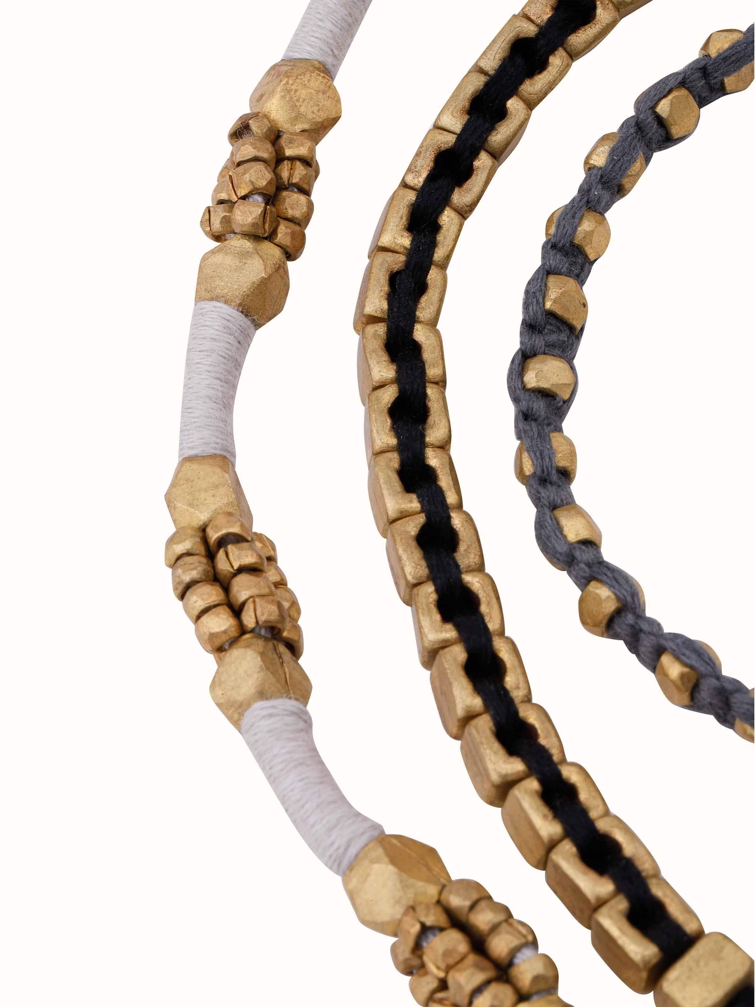 Angled view of Dhokra bracelet set (3 pcs) focusing on the detailed Dhokra designs