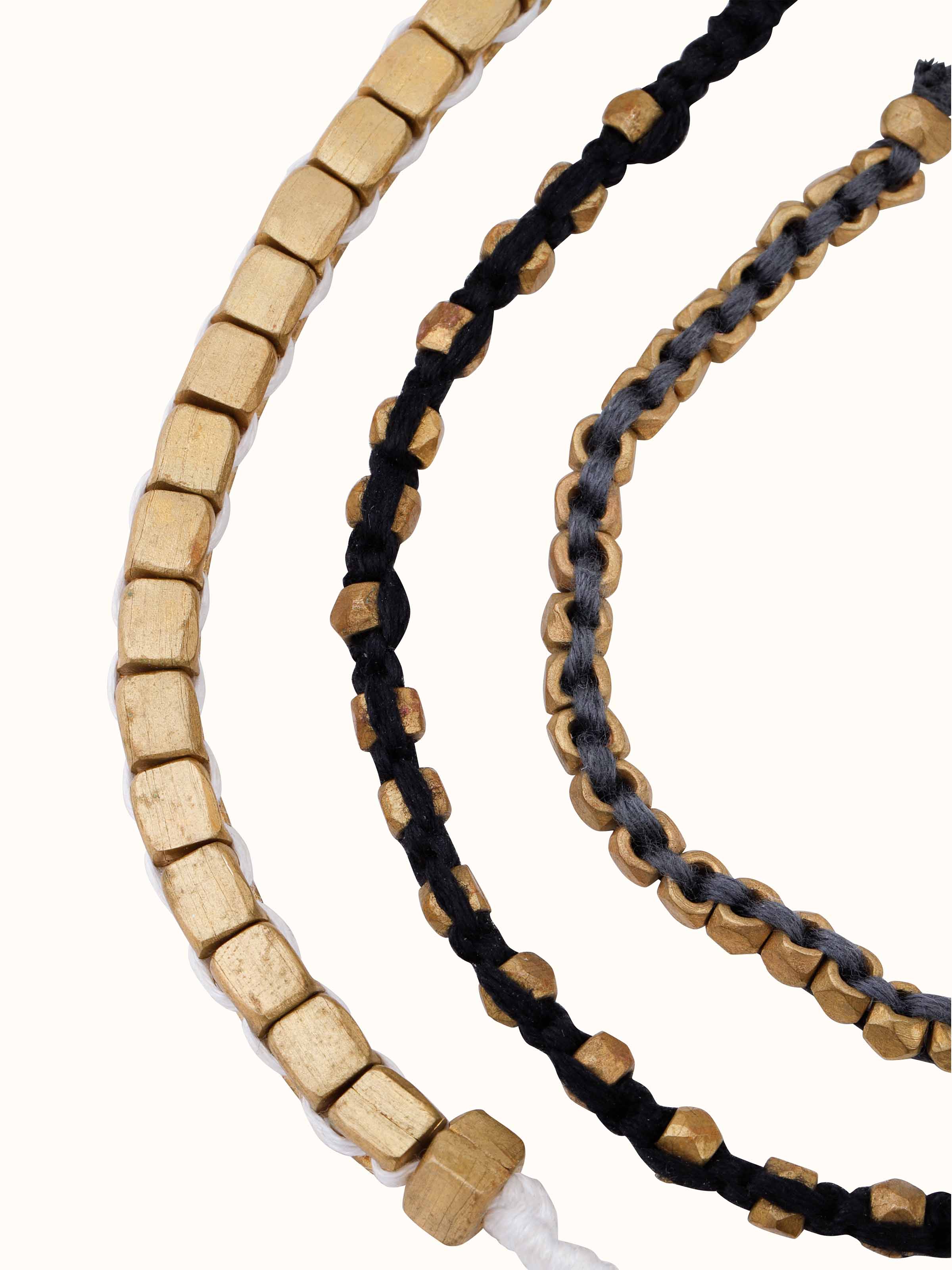 Angled view of Dhokra Bracelet Set (3 pcs) emphasizing traditional craftsmanship.