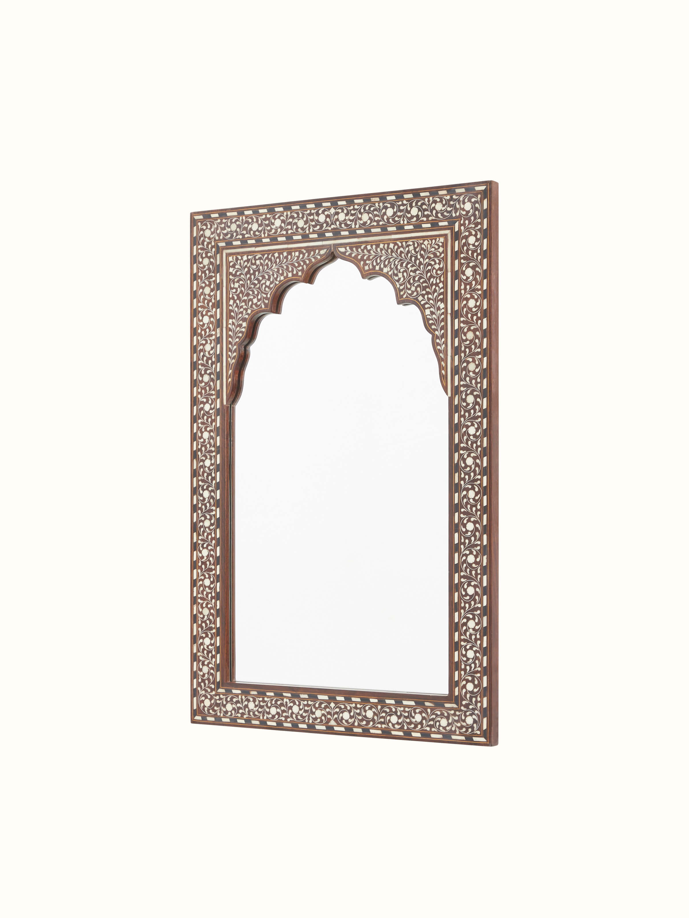 Angled view of the dressing table with the semicircular mirror and detailed bone inlay design