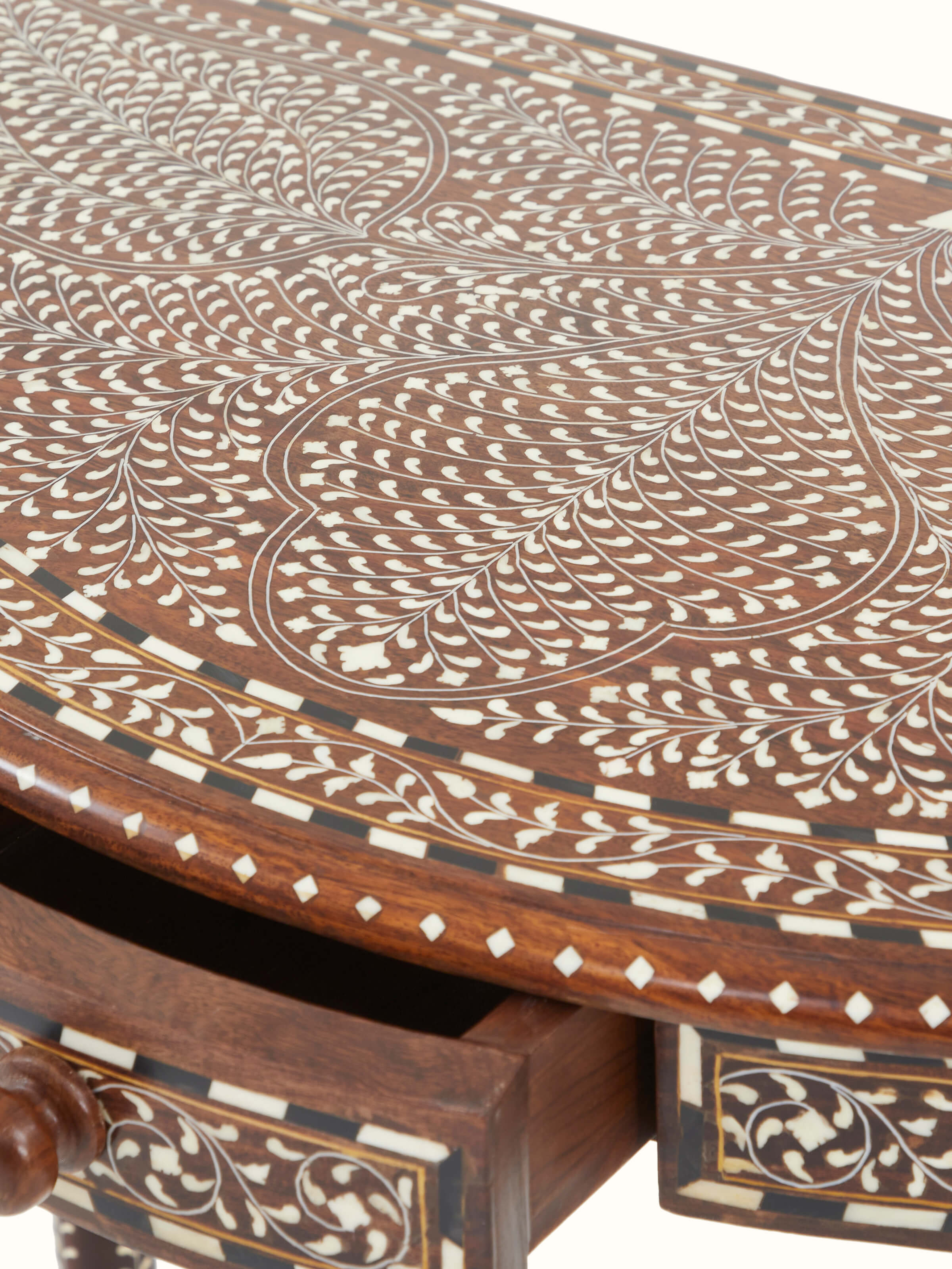 Side profile of the Sheesham wood and bone inlaid dressing table with semicircular console, emphasizing its elegant silhouette