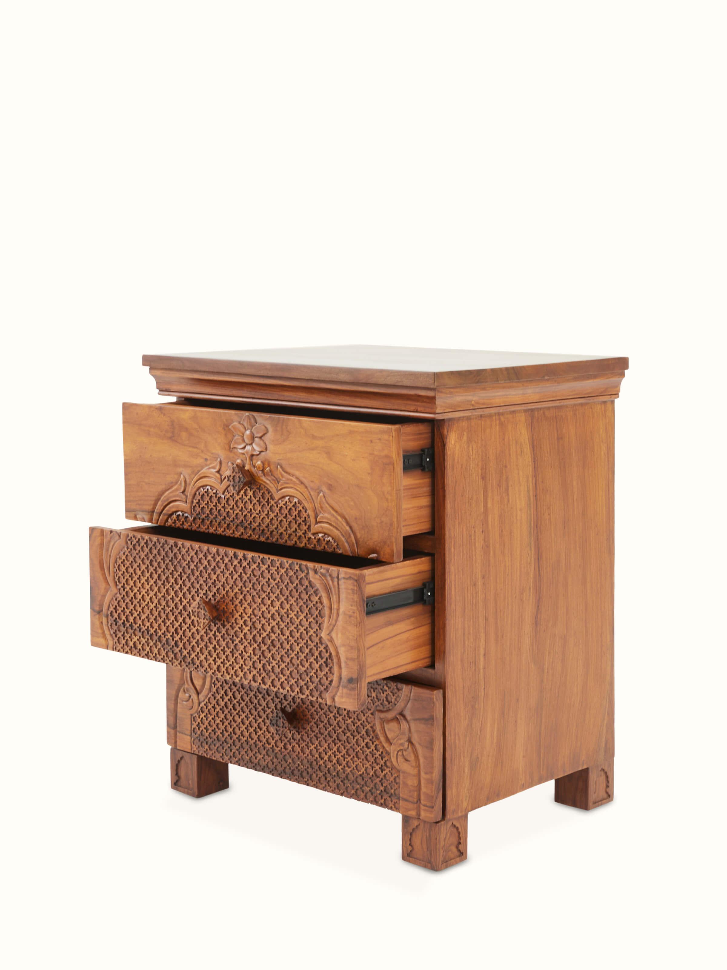 Close-up of the glass mirror and carved wood frame of the dressing table set